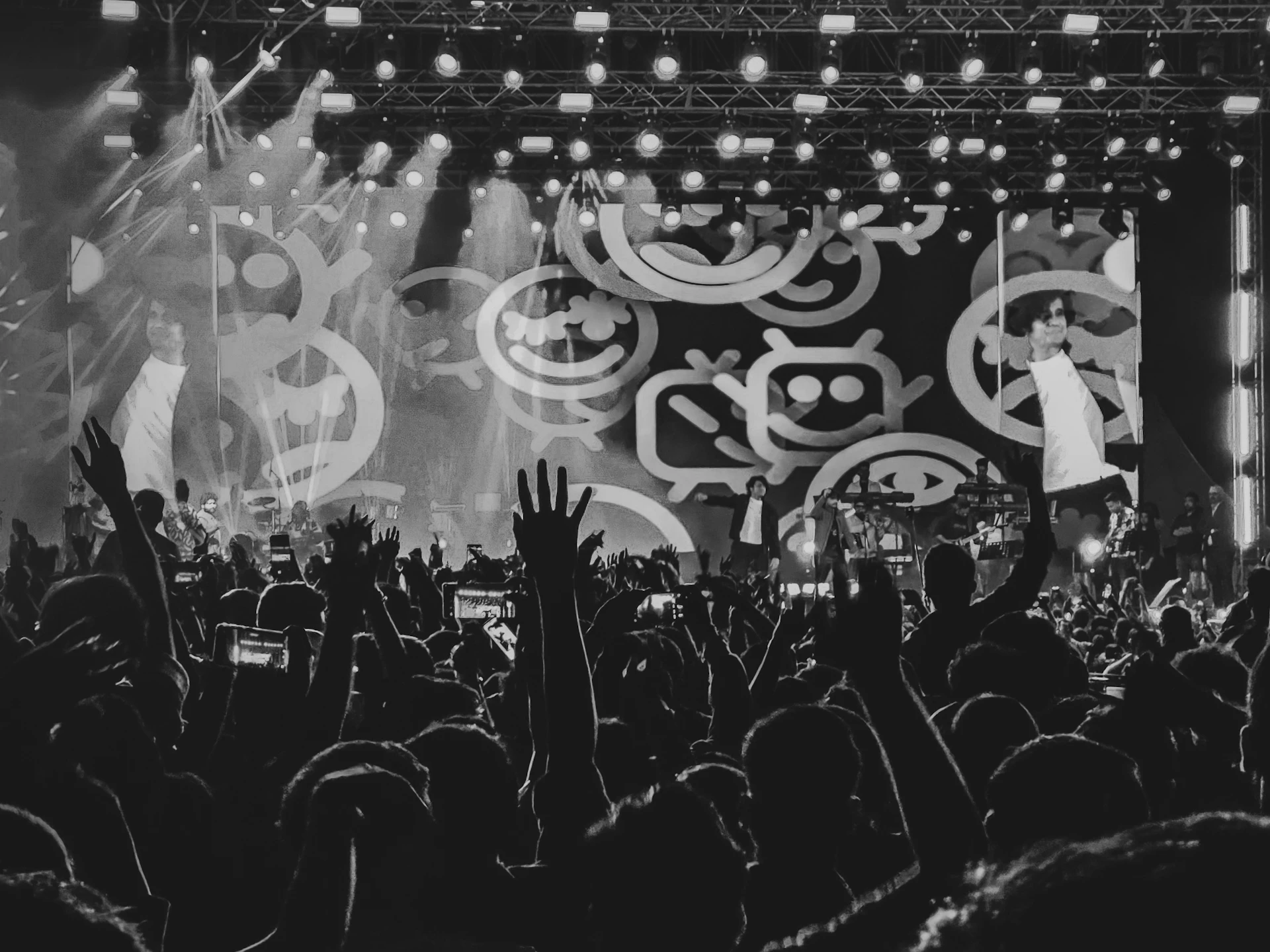 Crowd with hands raised at a concert