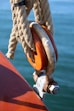 Wooden pulley with rope on a boat