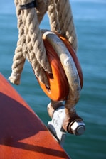 Wooden pulley with rope on a boat