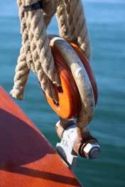 Wooden pulley with rope on a boat