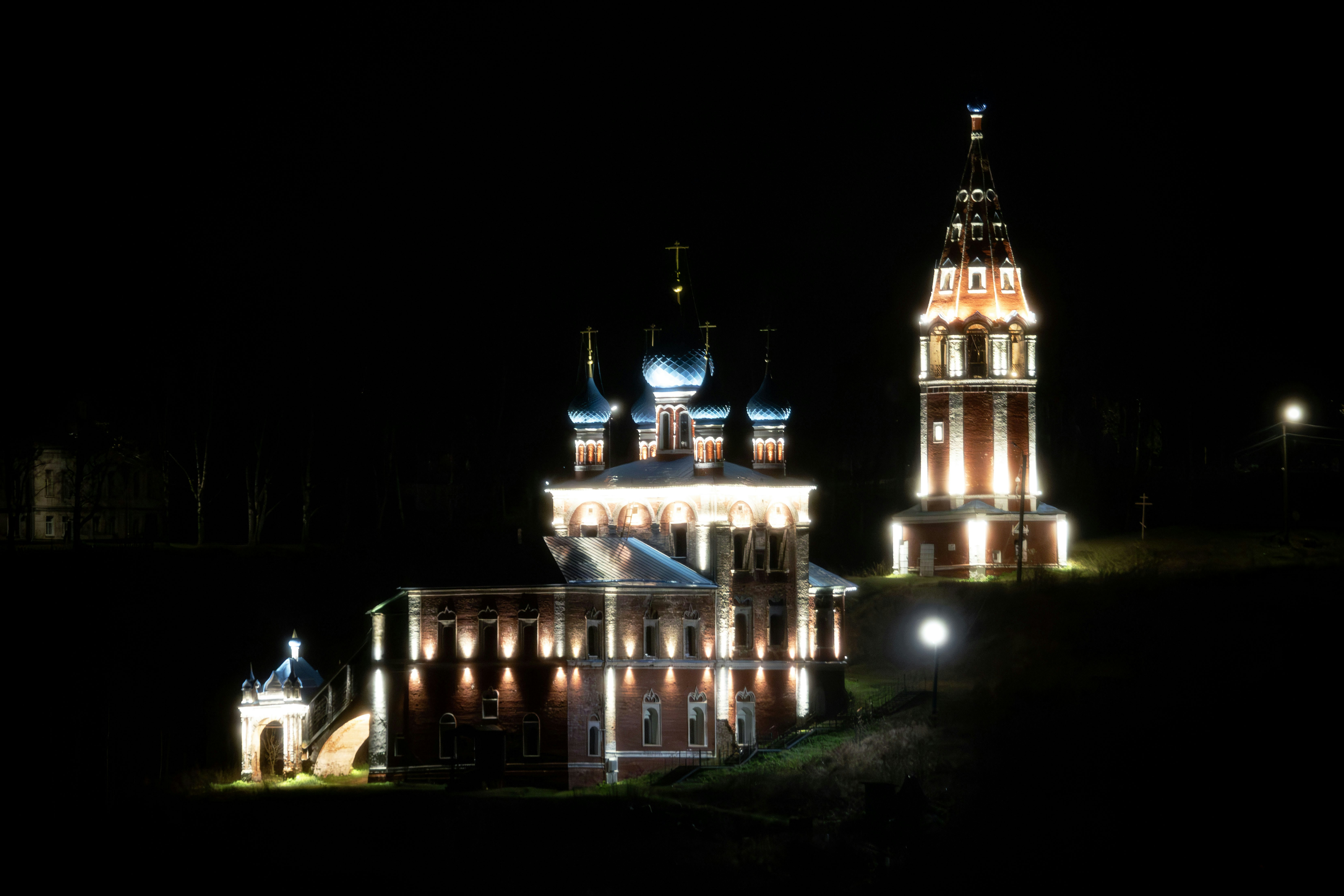 Illuminated church and bell tower at night
