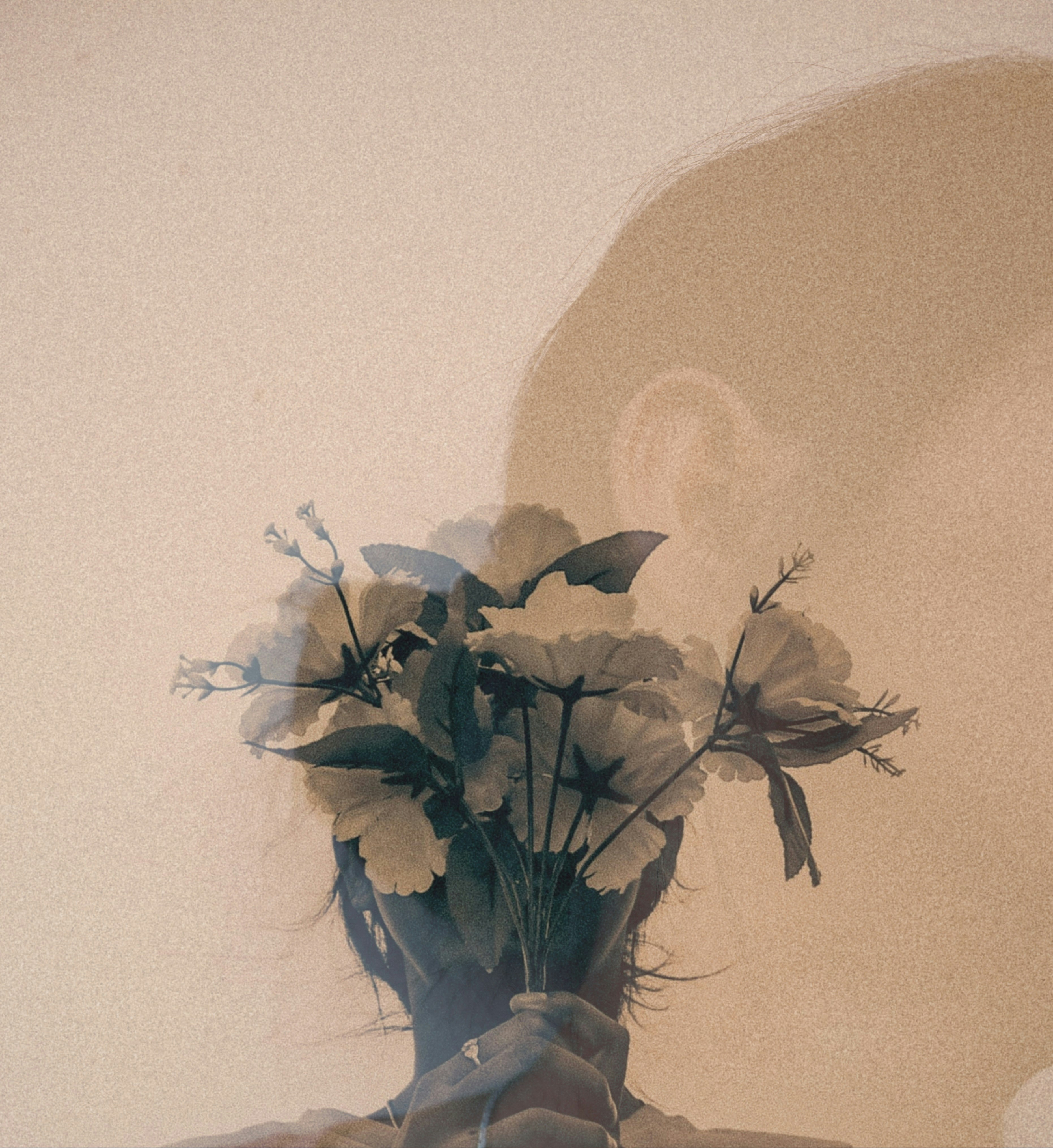 A person holding a bouquet of white flowers.