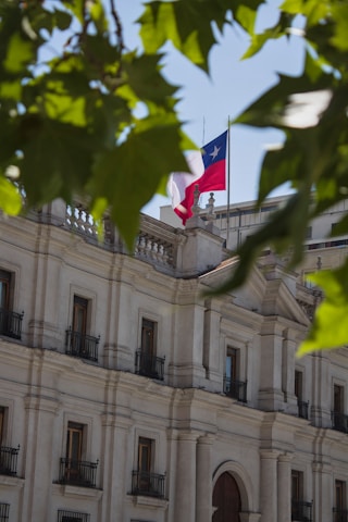 Chilean flag flying above a white building