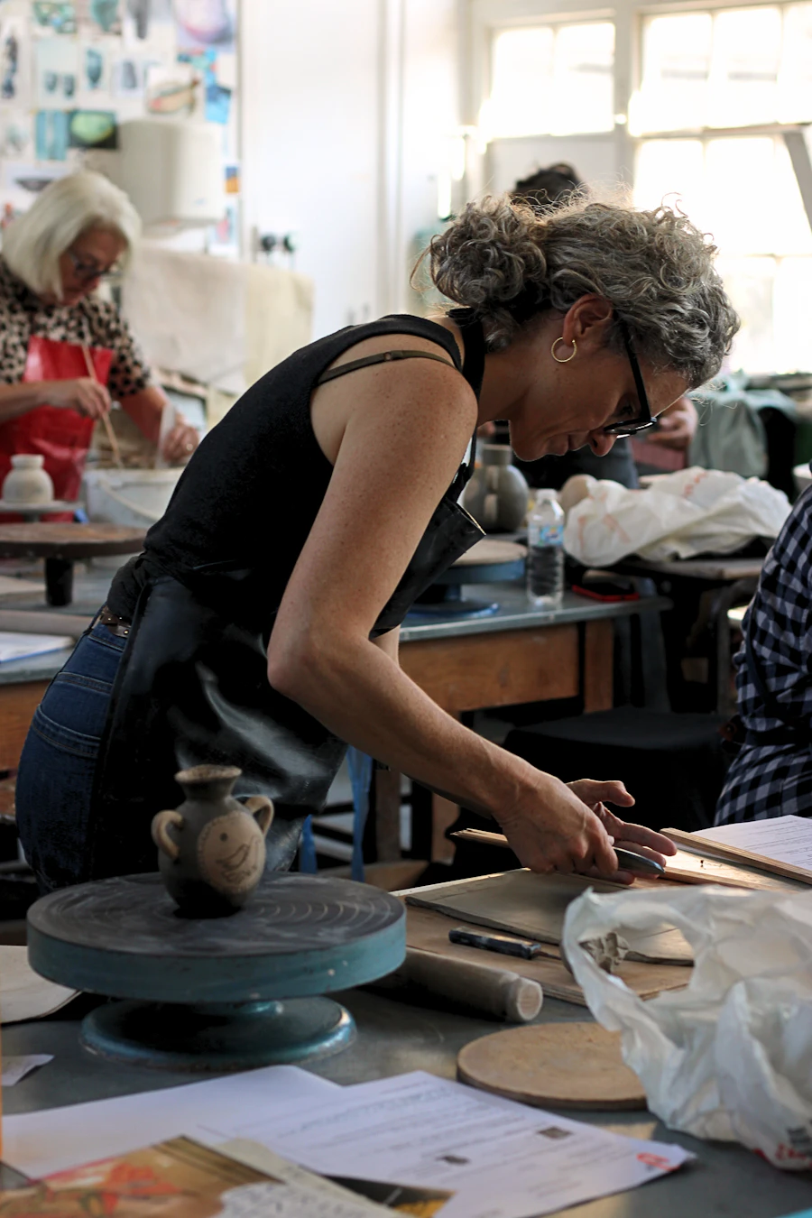 Potter working with clay in the studio