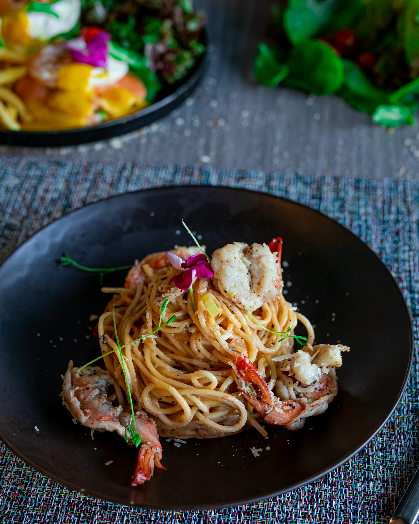 Refined pasta on black plate