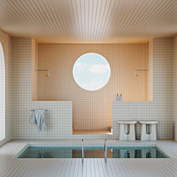 Modern bathroom with a small pool and round window.