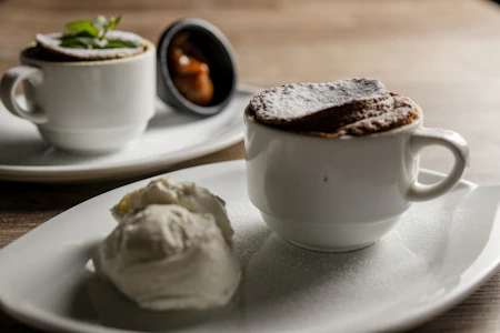 Two chocolate soufflés with ice cream