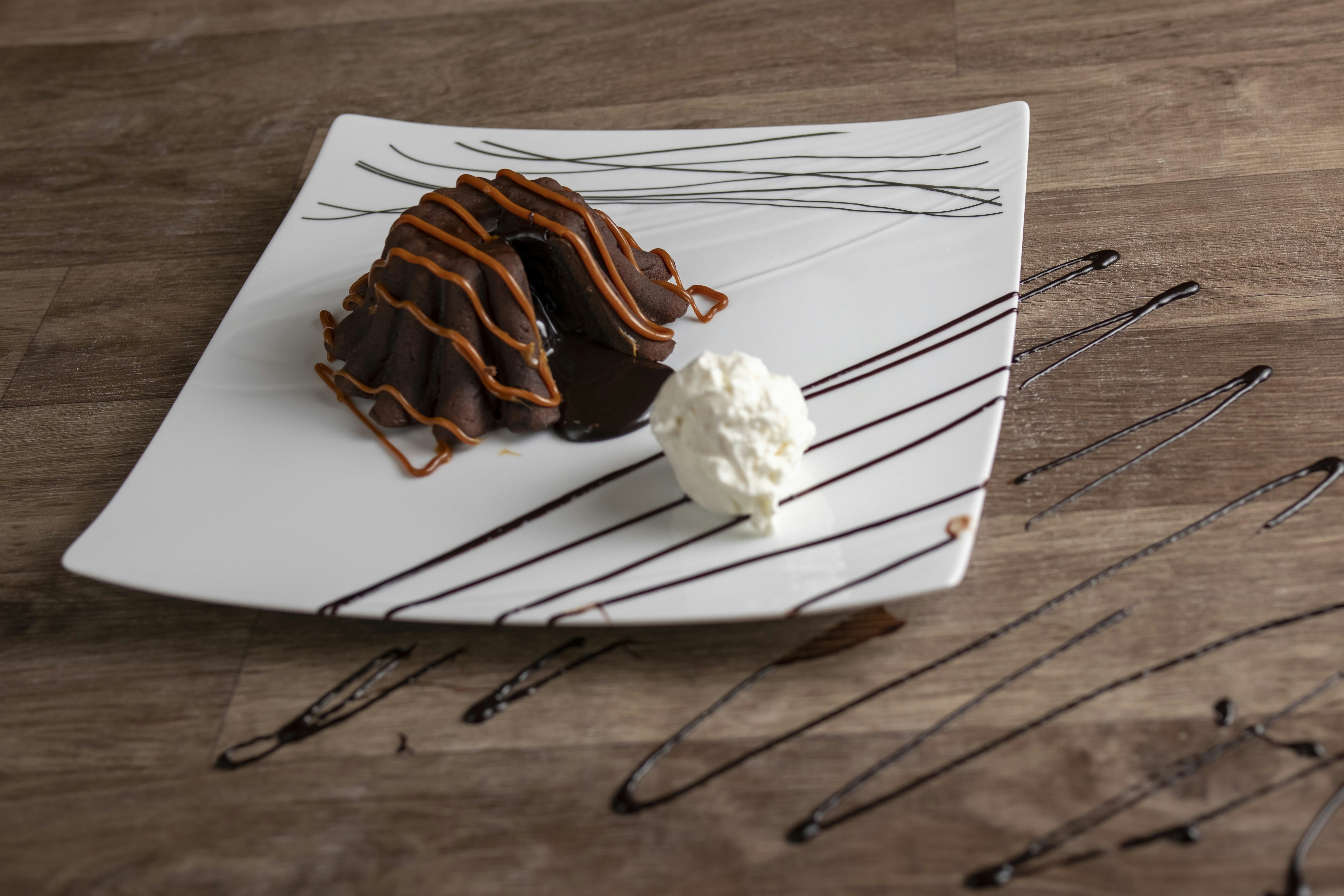 Decadent chocolate cake with whipped cream and drizzle