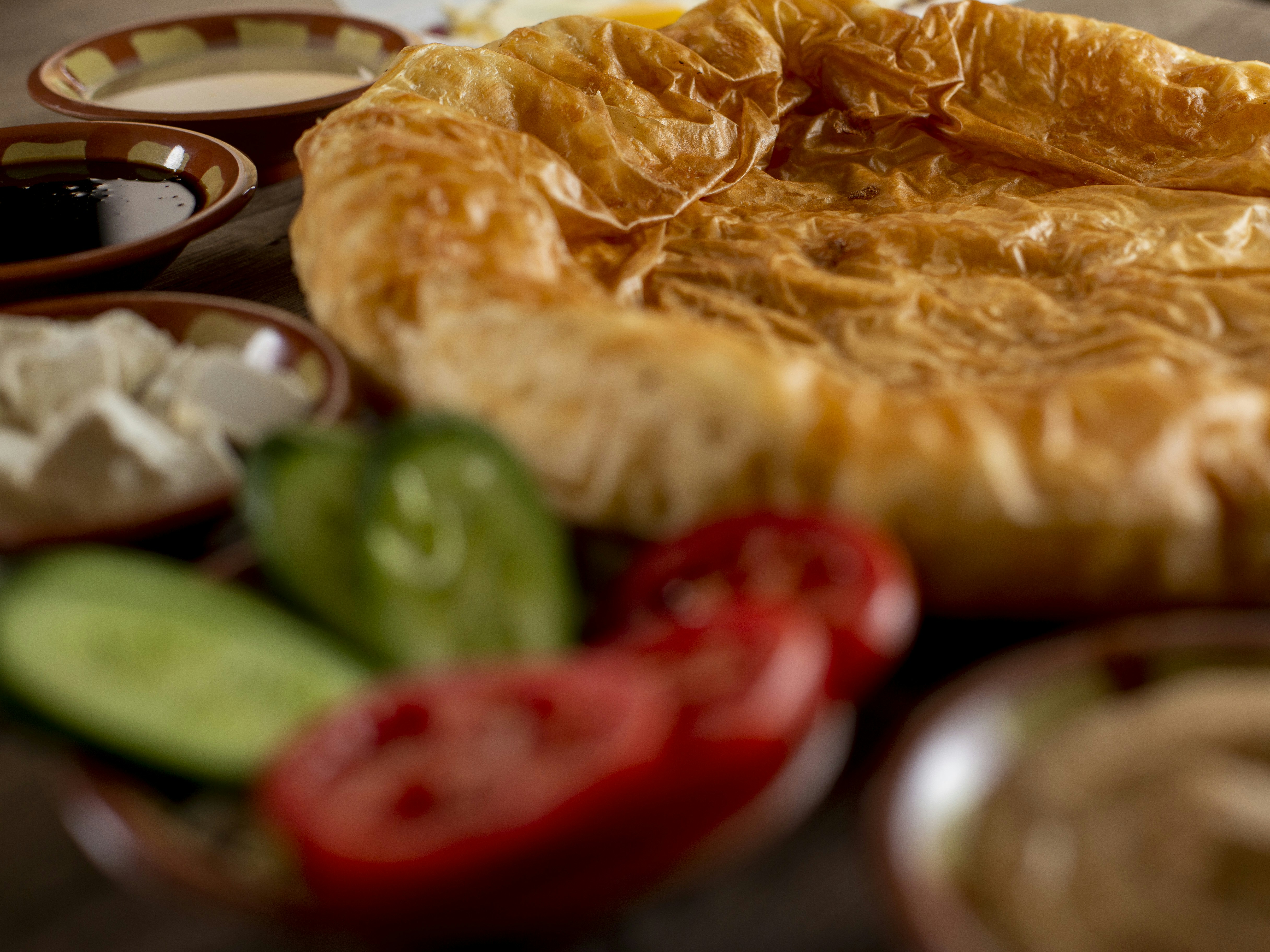 Savory pastry with fresh vegetables and dips