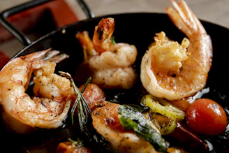 Cooked shrimp and vegetables in a pan
