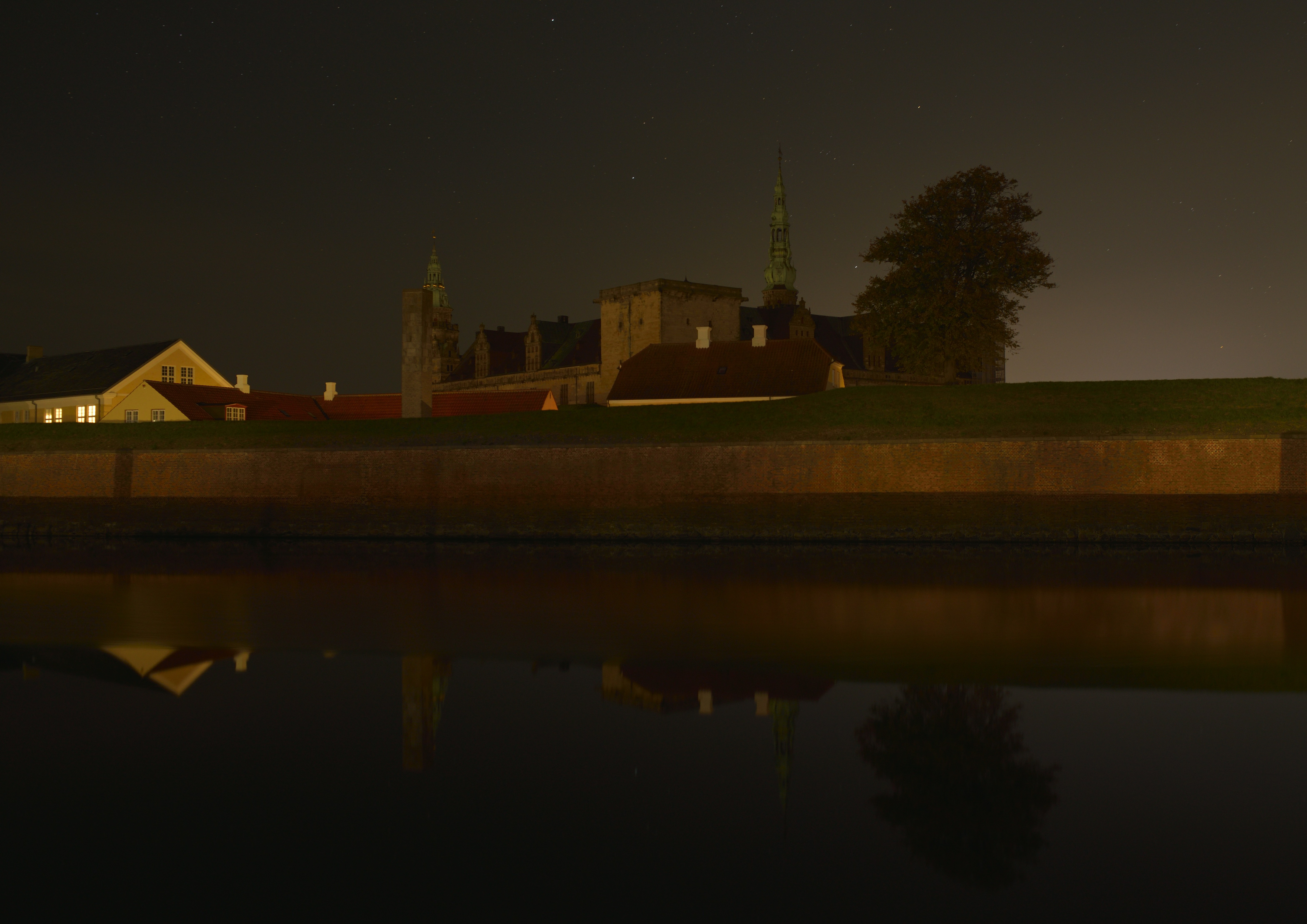 Buildings reflected in water at night