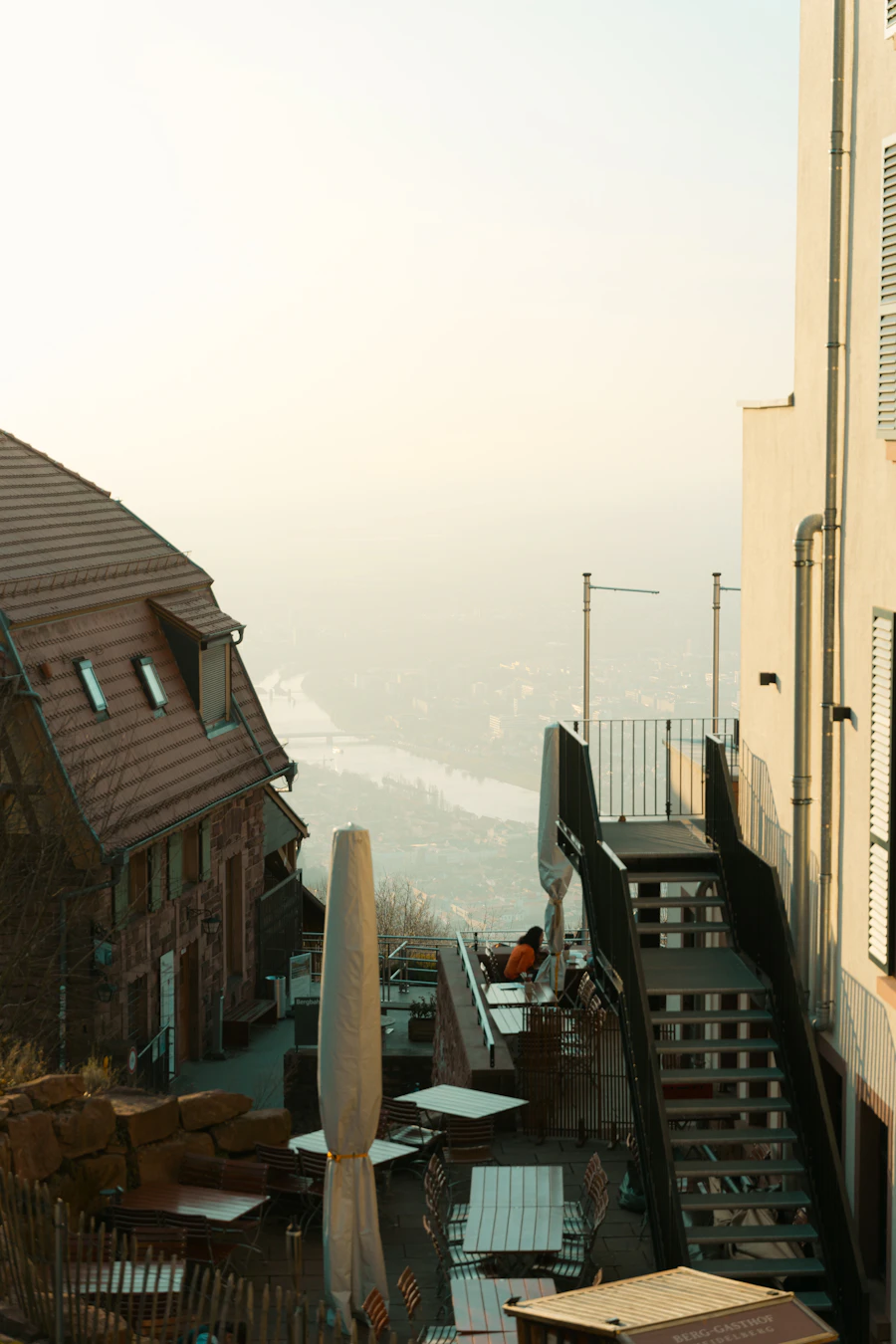 Hillside cafe overlooking a town landscape