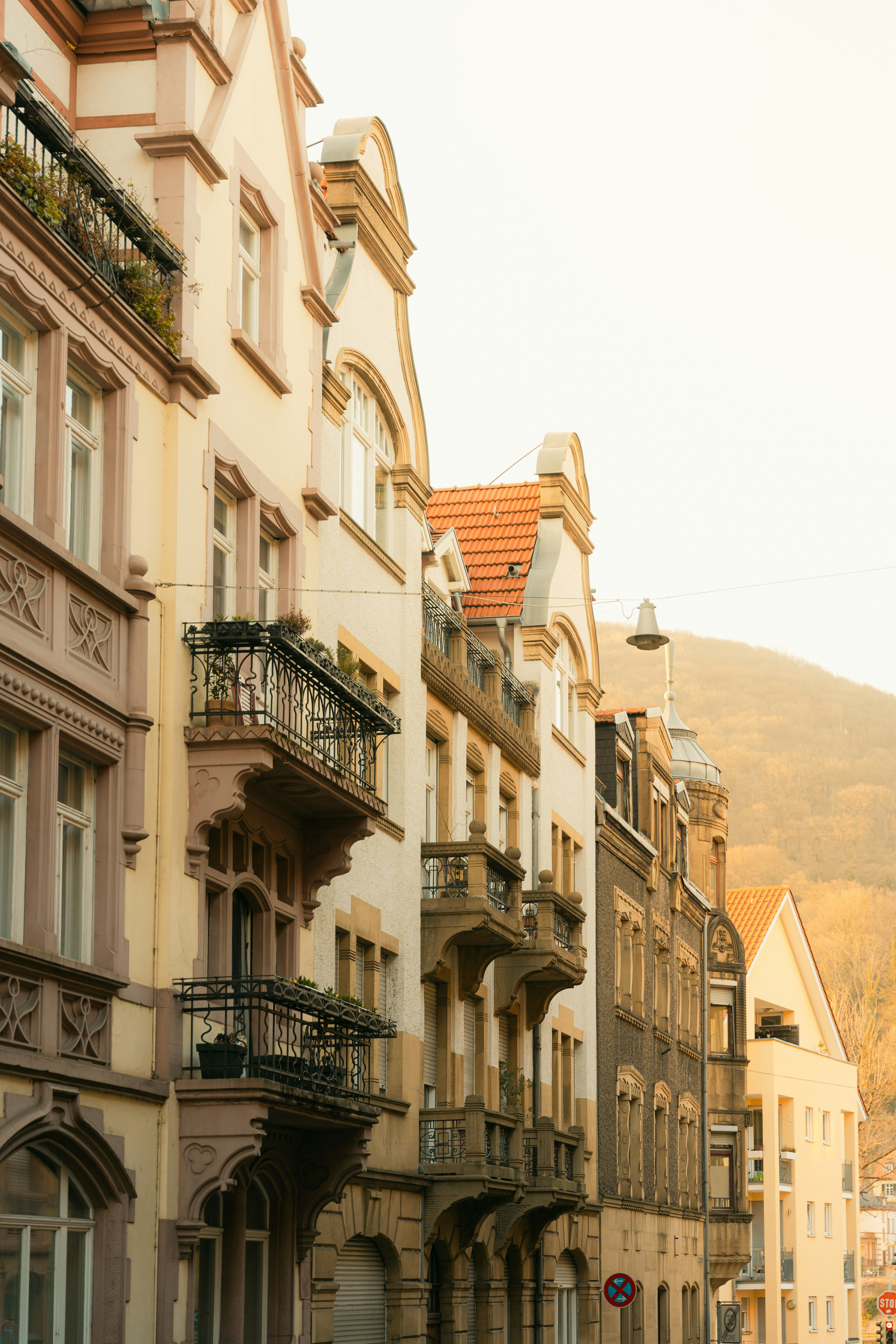Row of historic buildings with balconies and windows.