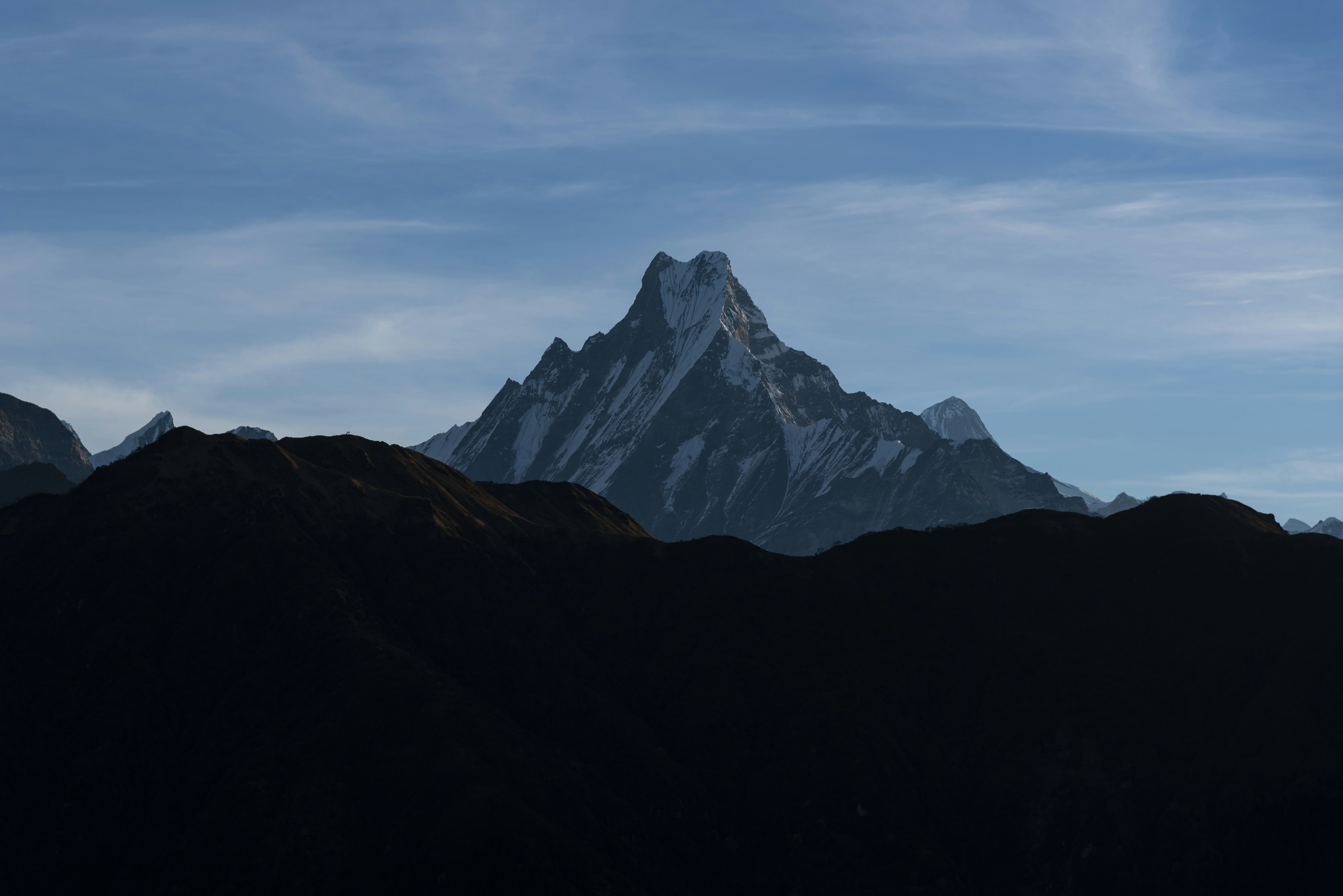 Jagged mountain peak against a blue sky.