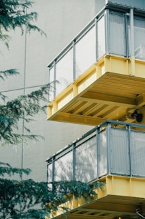 Modern balconies with yellow accents and glass railings