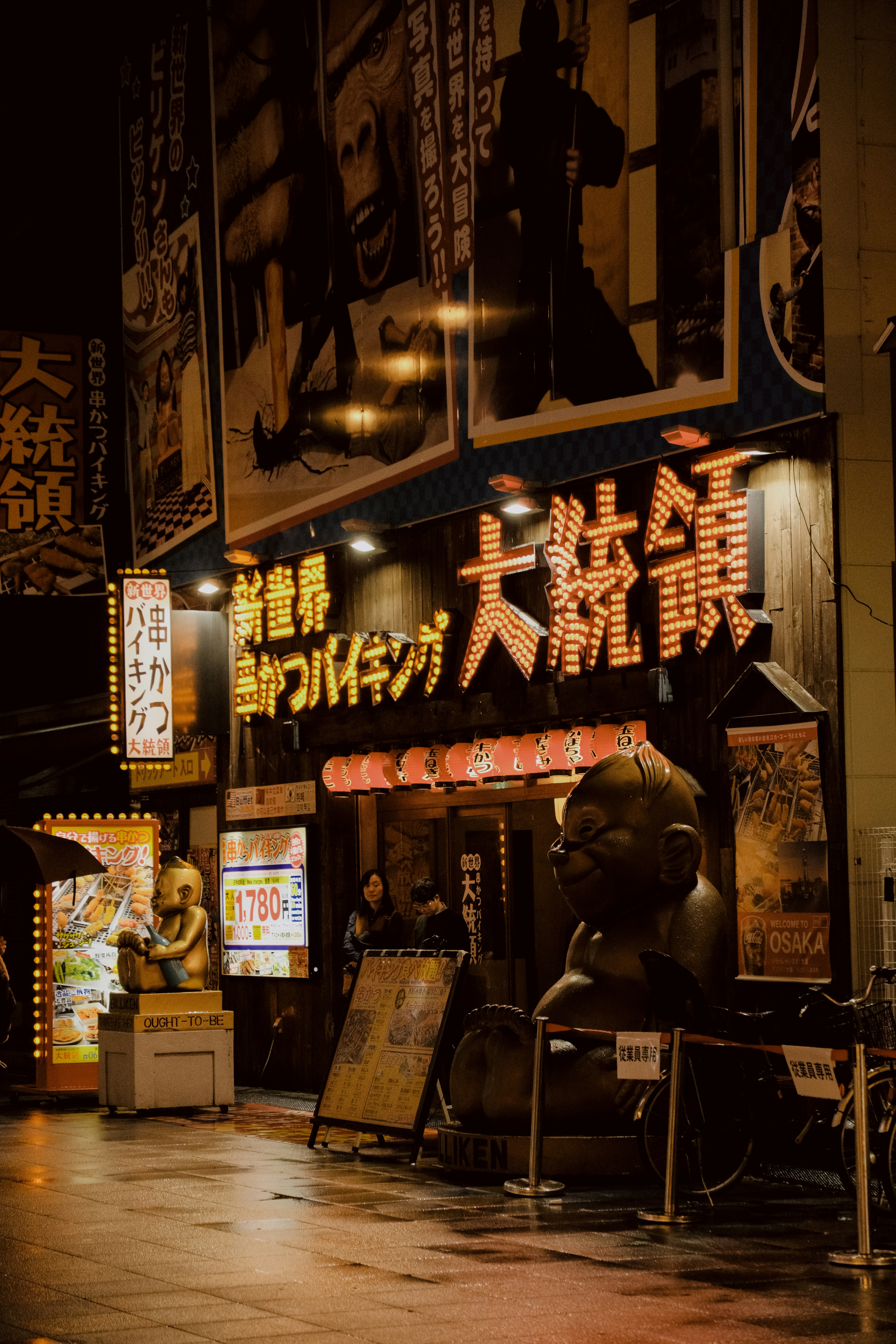 Night market entrance and travelers