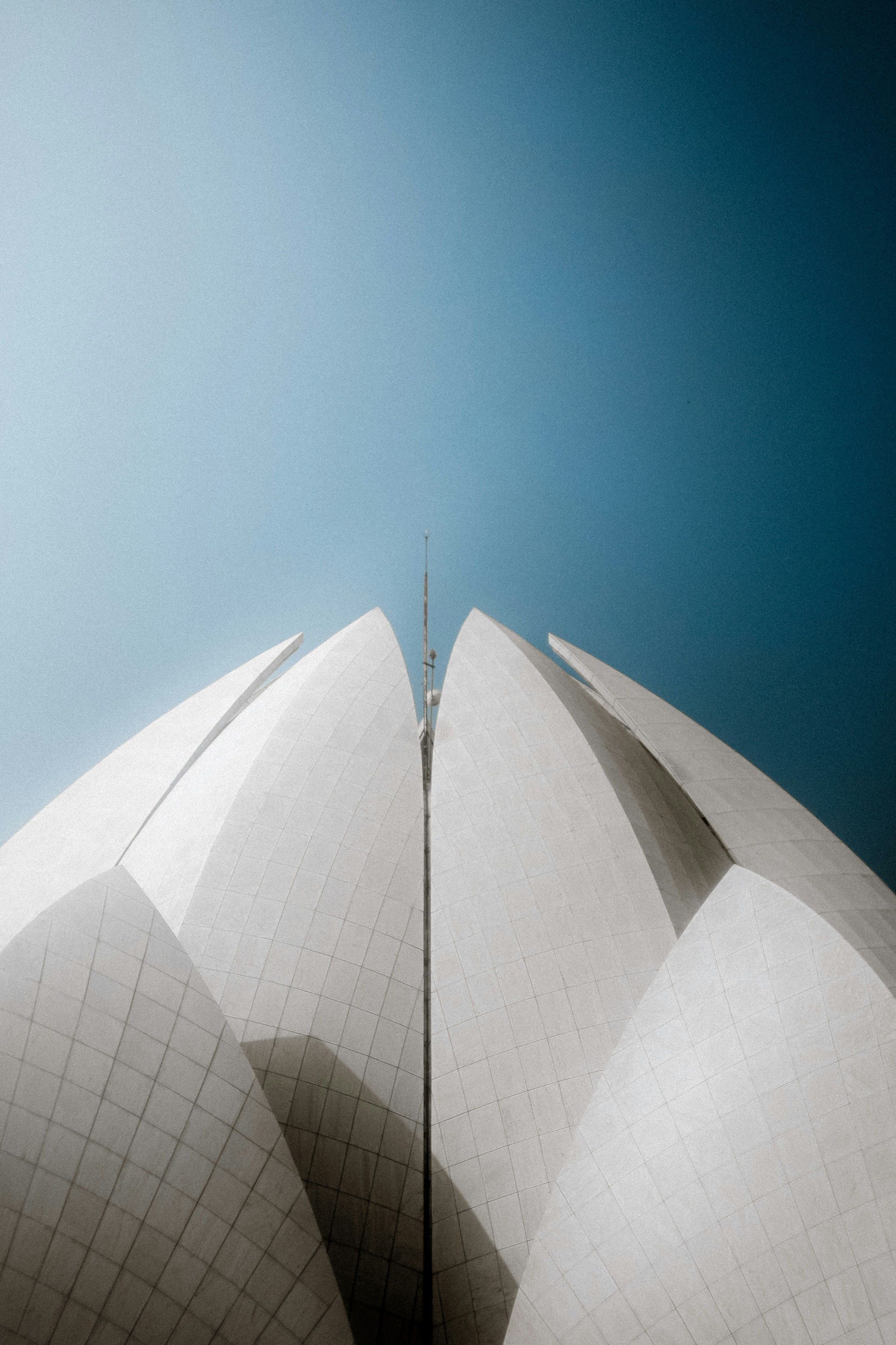 Modern white building against a clear blue sky
