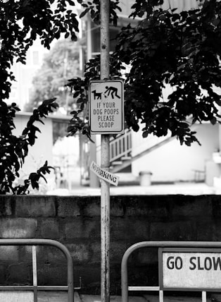 Sign reminds dog owners to scoop poop