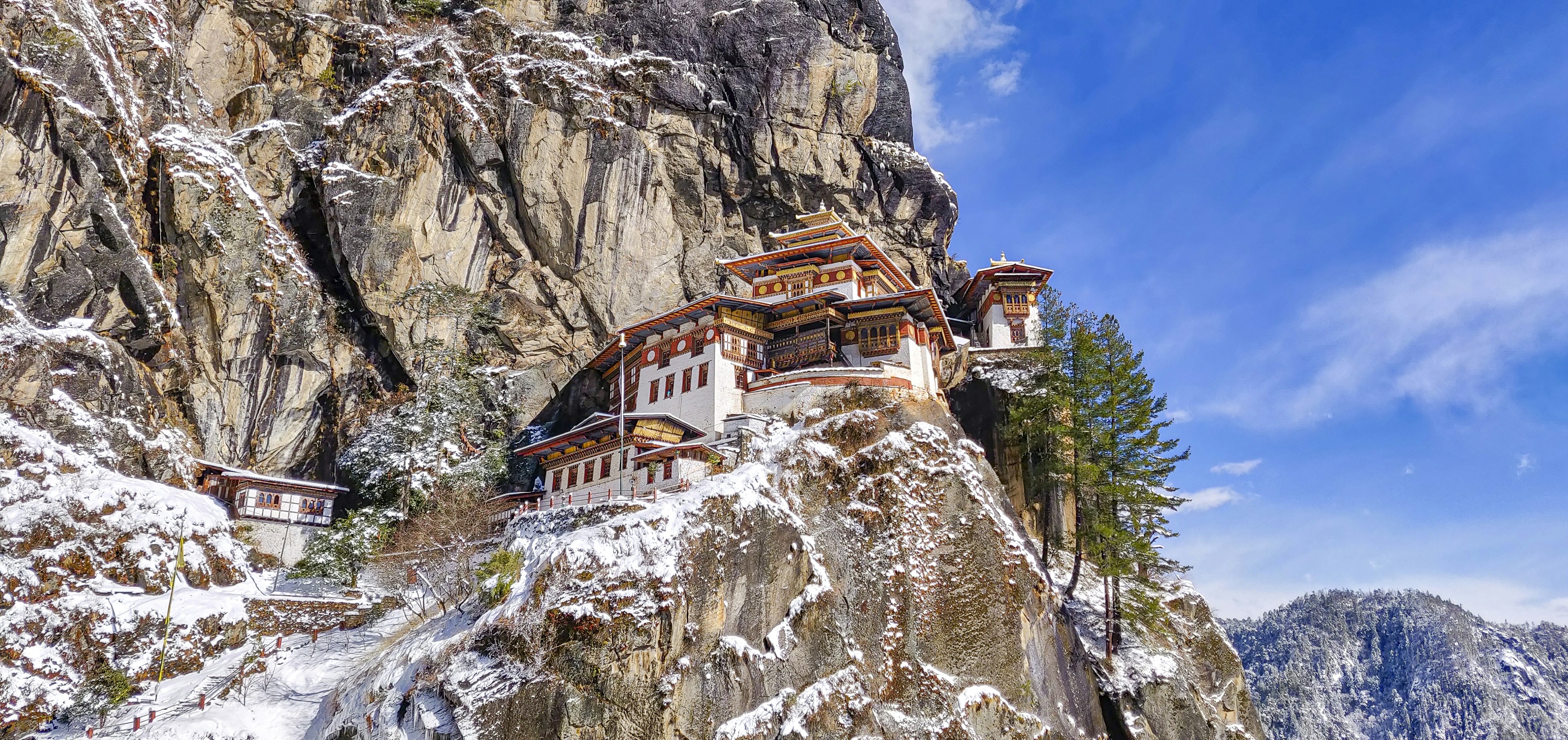 Monastery clinging to a snowy cliff face