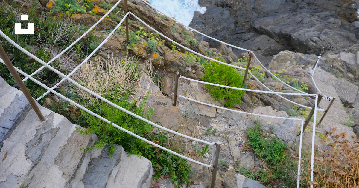 Stone steps with ropes lead down to the ocean. photo – Free Hiking ...