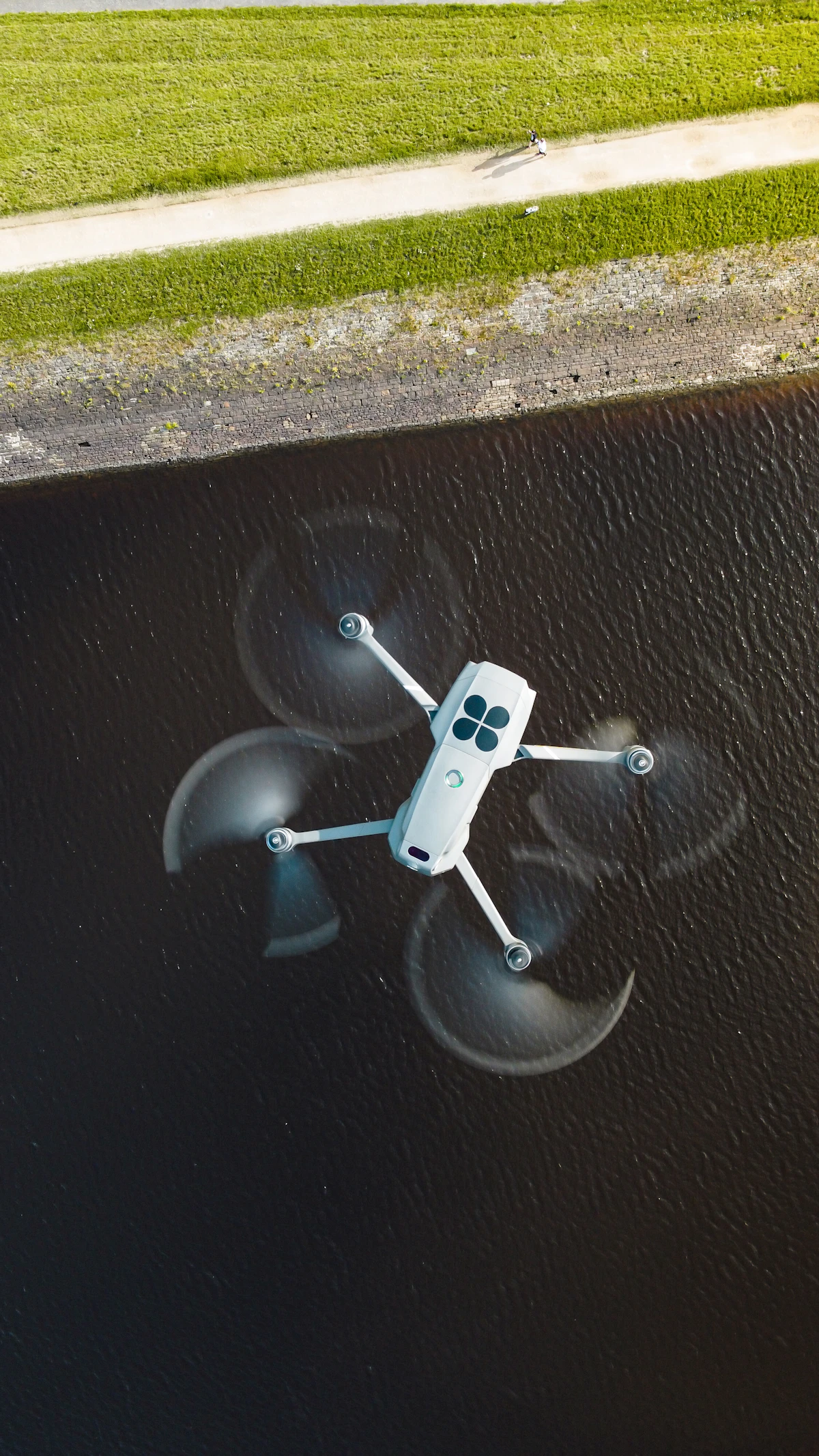 Survey drone in flight over open land