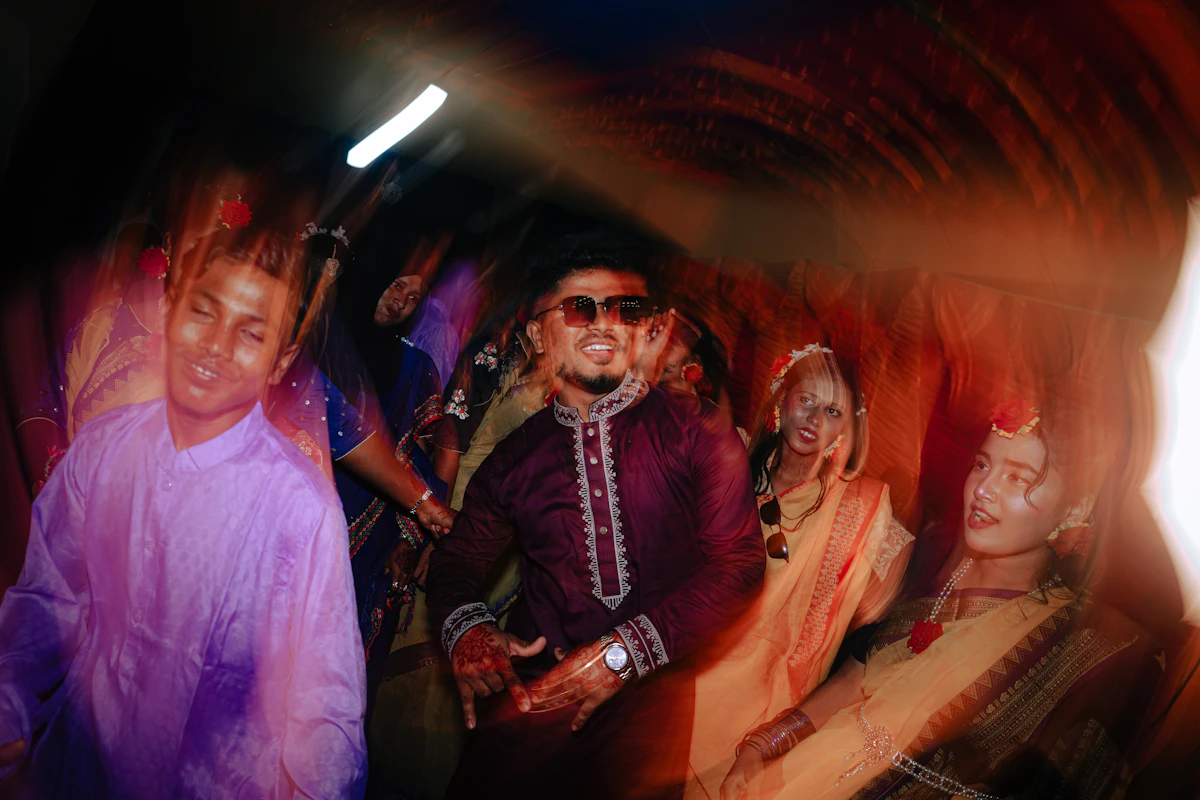 People dancing at a lively event with motion blur