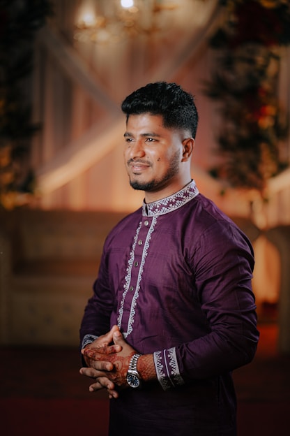 Man in purple kurta with intricate embroidery