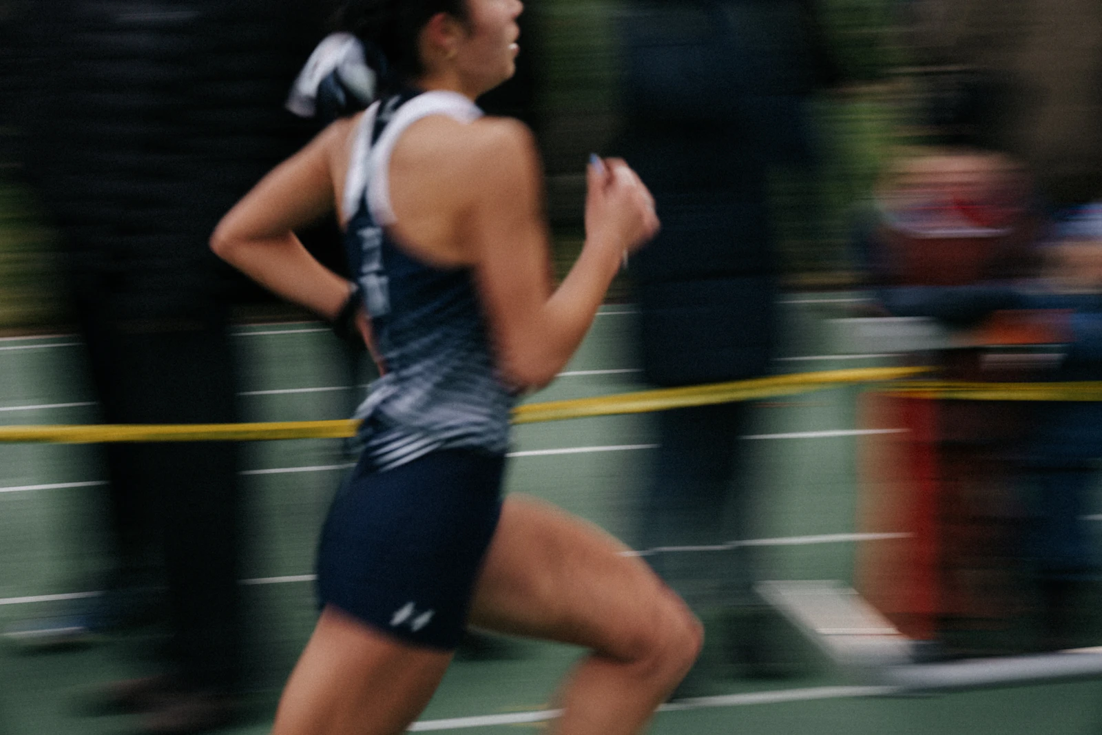 A runner racing on the track