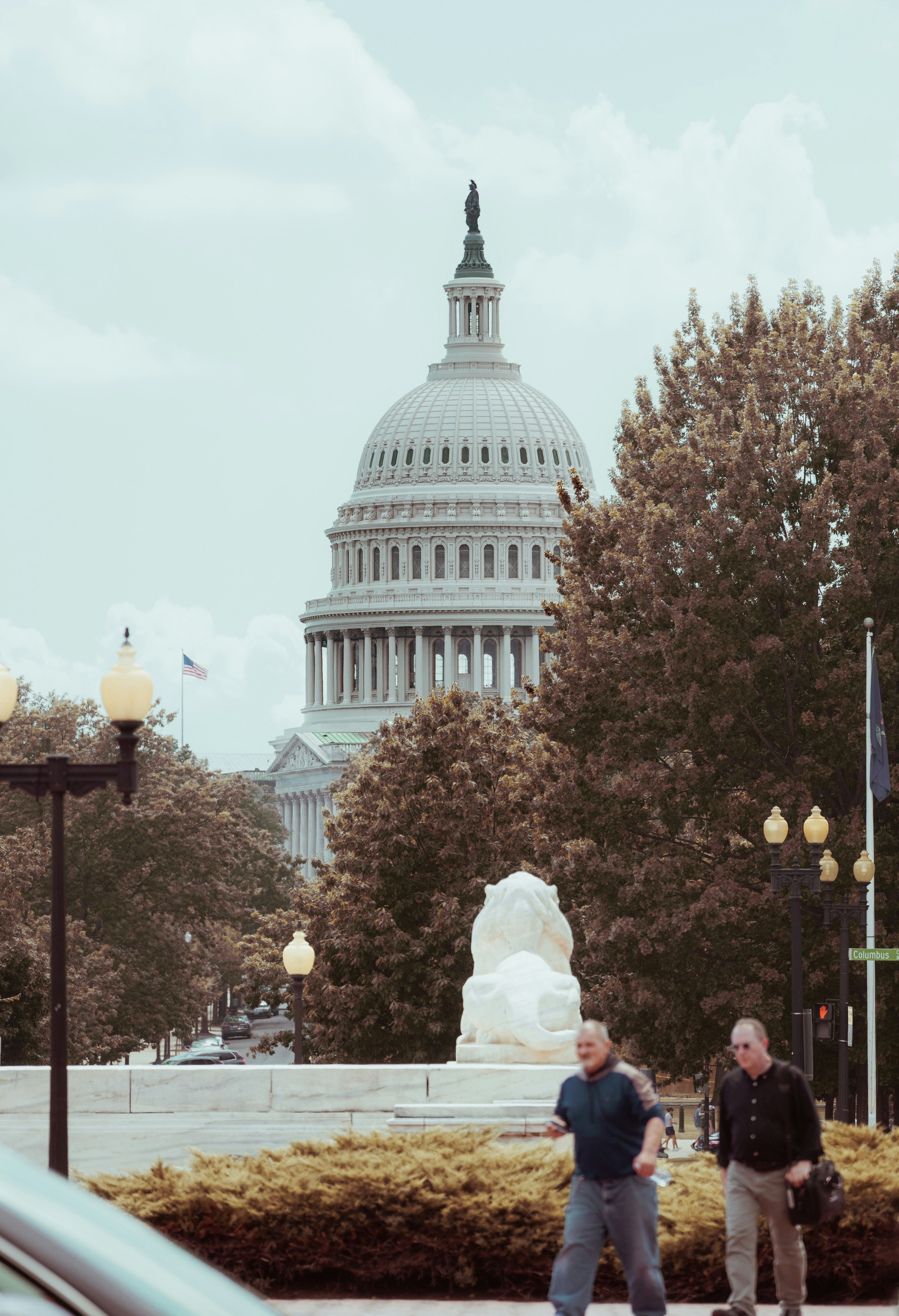 The u.s. capitol building with people walking
