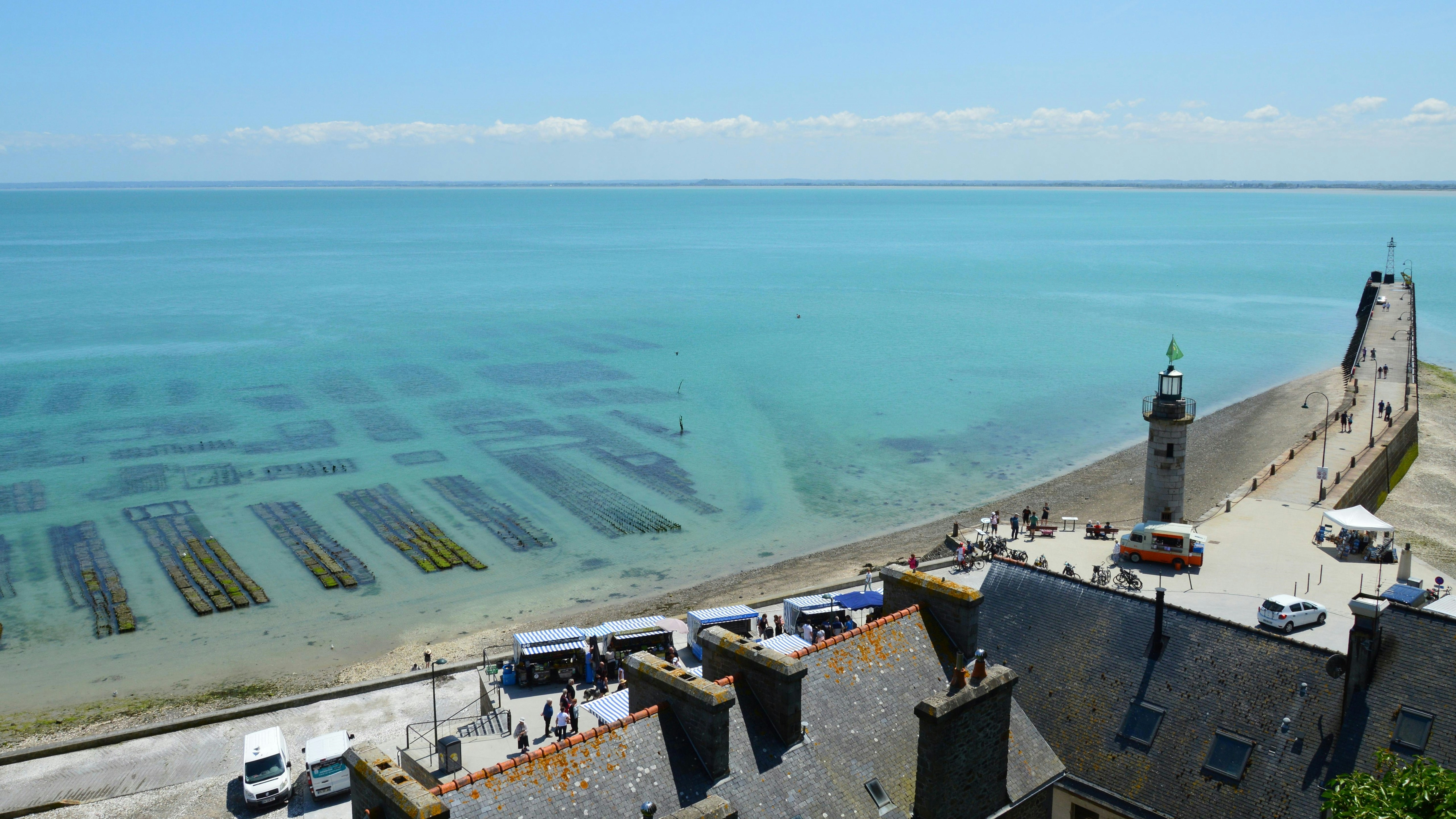 Oyster farms in the clear blue ocean water.