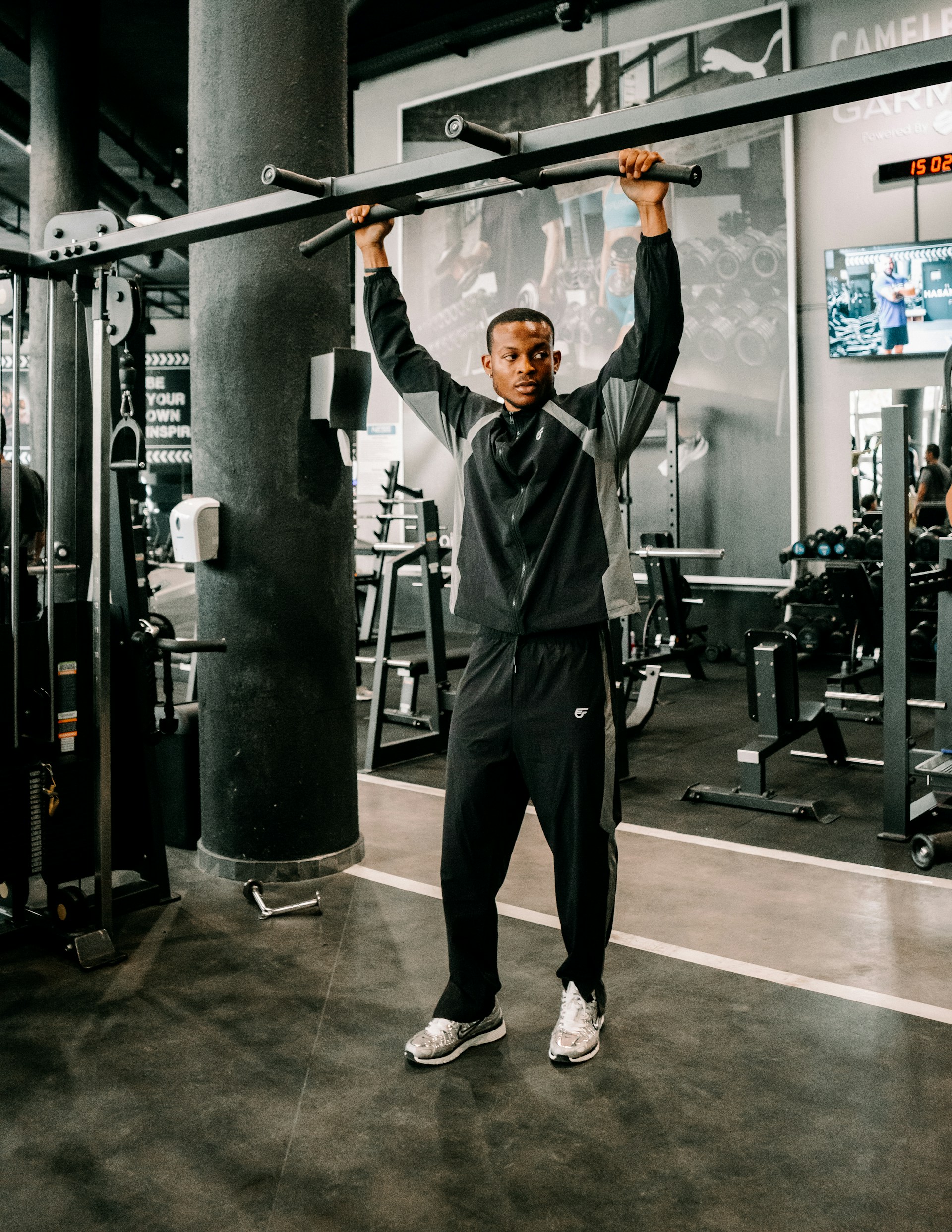 Man holding bar in a gym