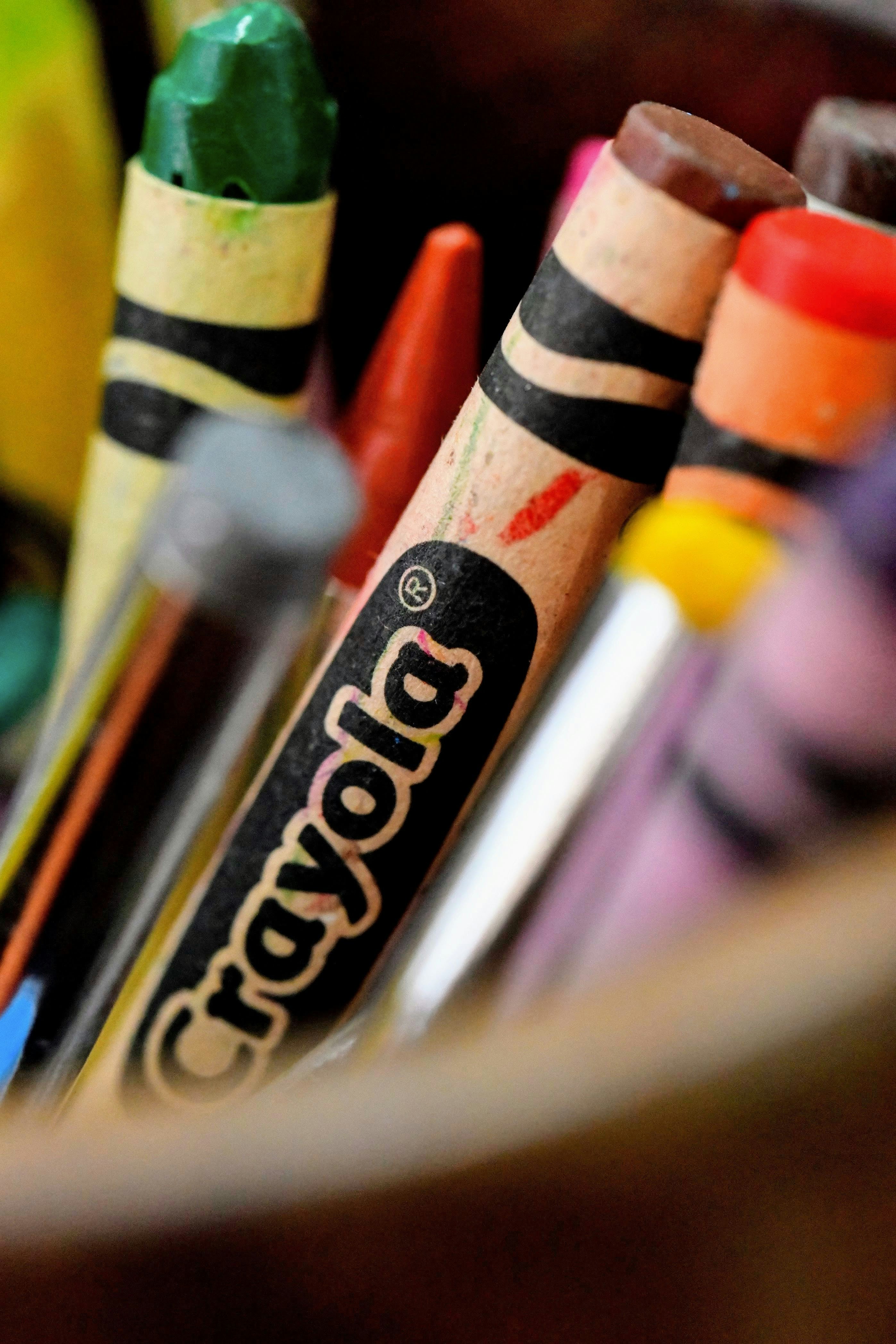 Close-up of crayola crayons in a container.