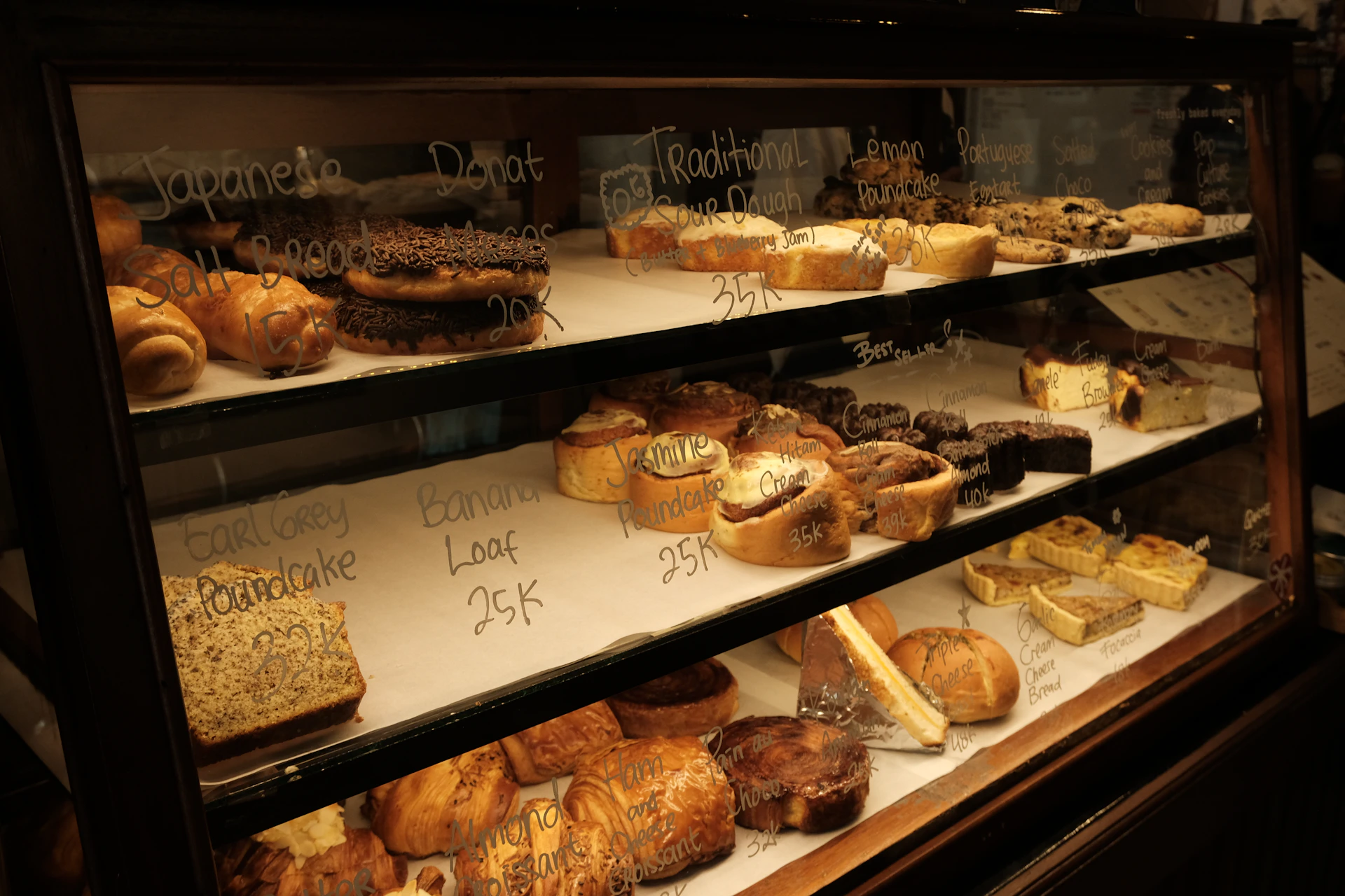 Display case filled with various baked goods and pastries.