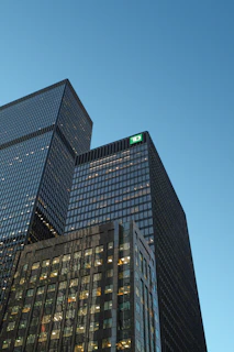 Modern skyscrapers against a clear blue sky.