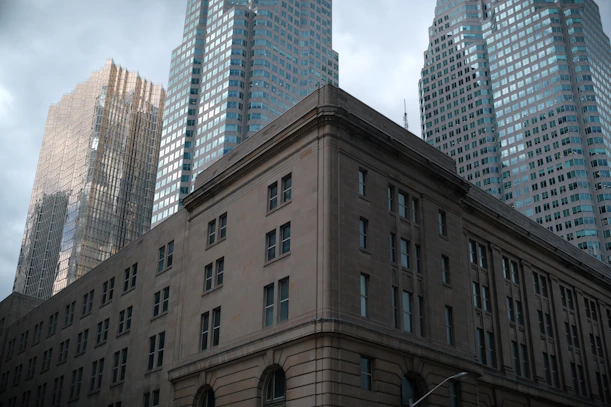 Modern skyscrapers behind a classical building