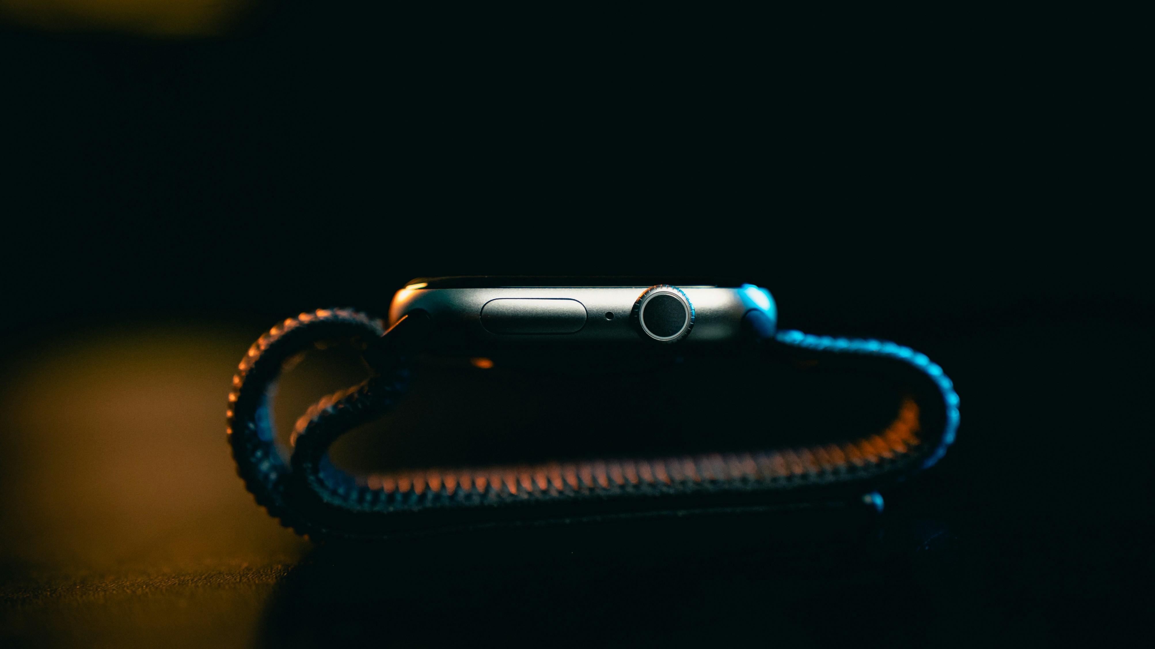 Smartwatch with a textured band in dramatic lighting