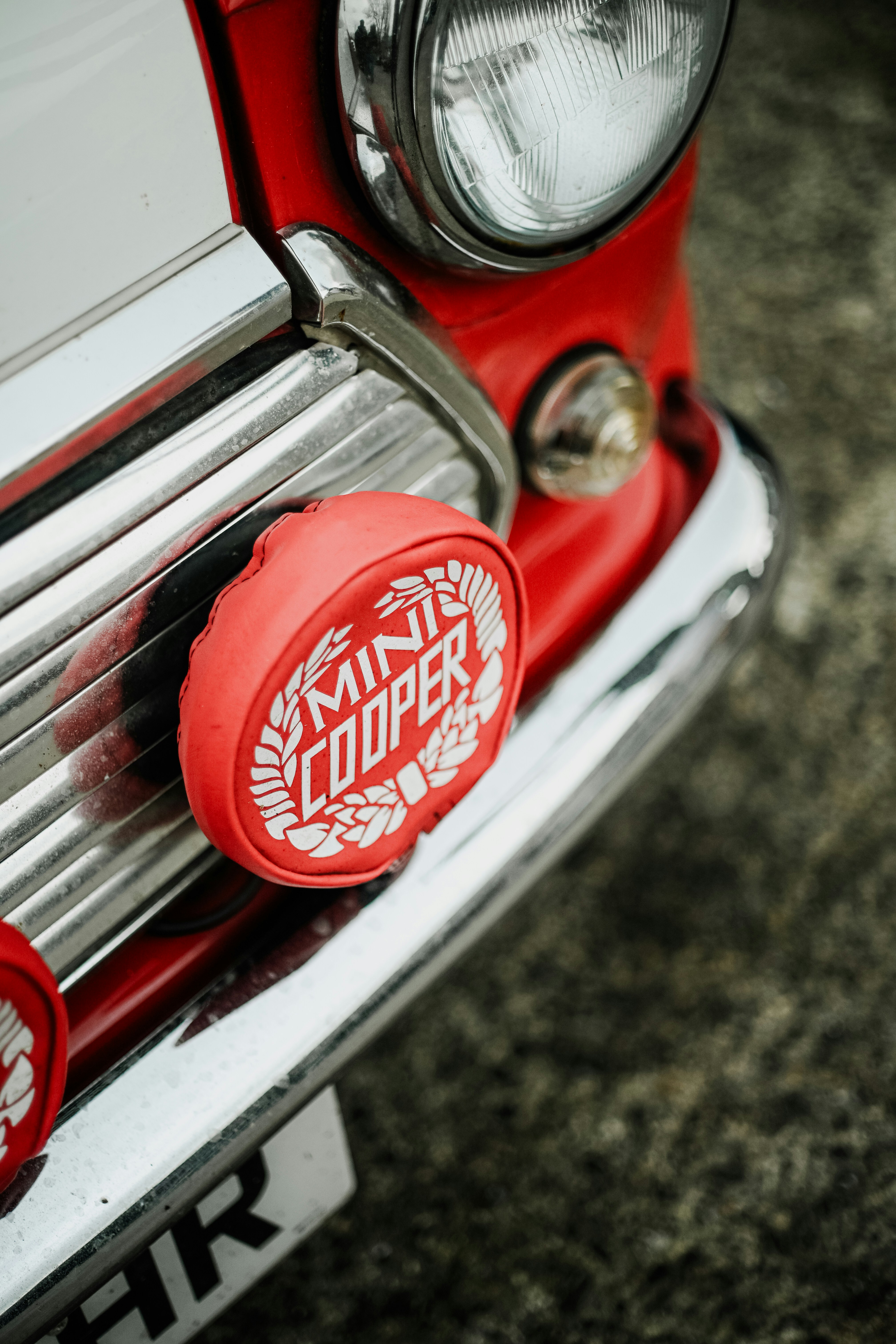 Close-up of a vintage mini cooper car grille.