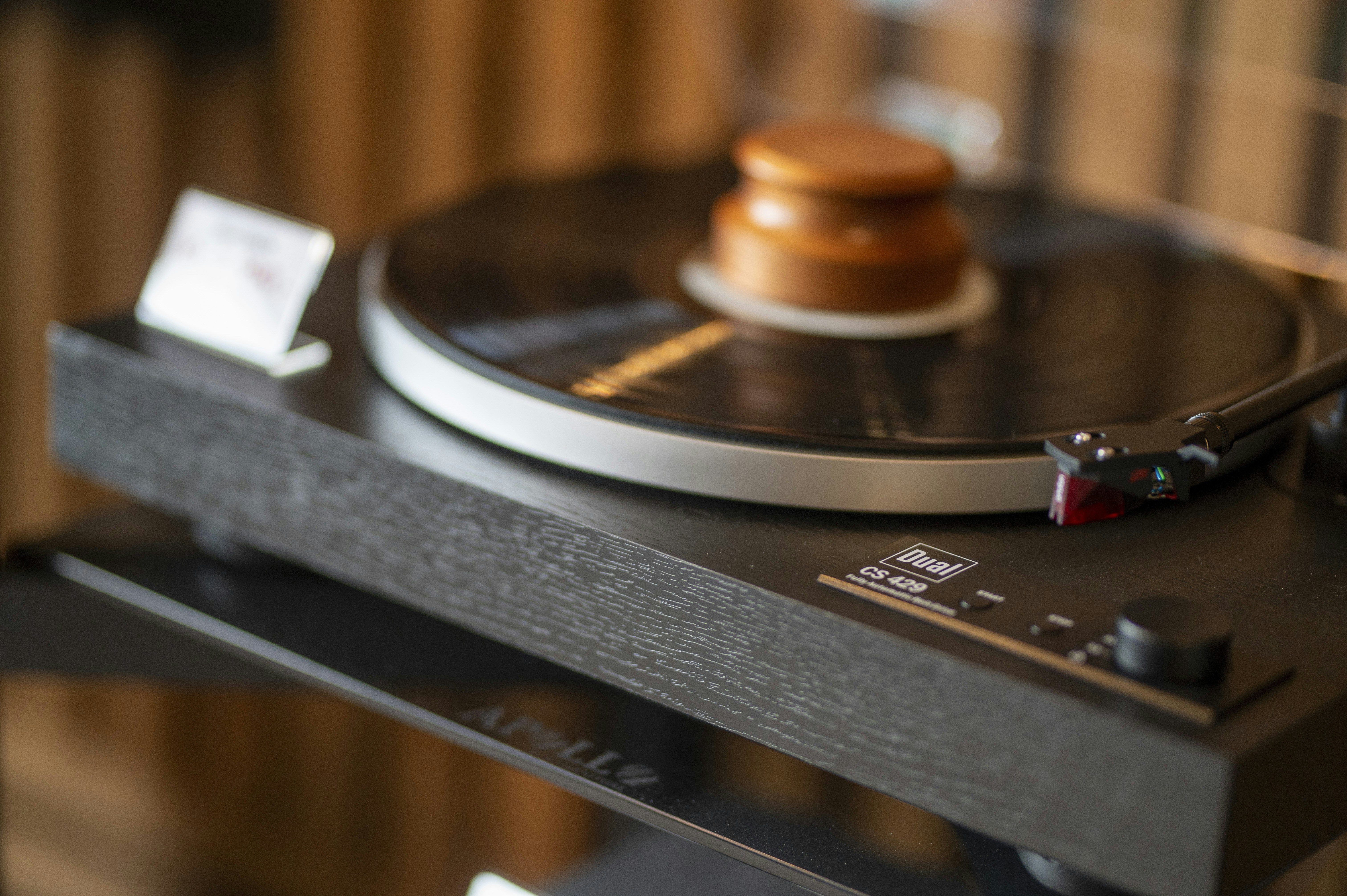 Close-up of a vintage record player with a vinyl record.