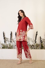 Woman in red floral outfit with heels