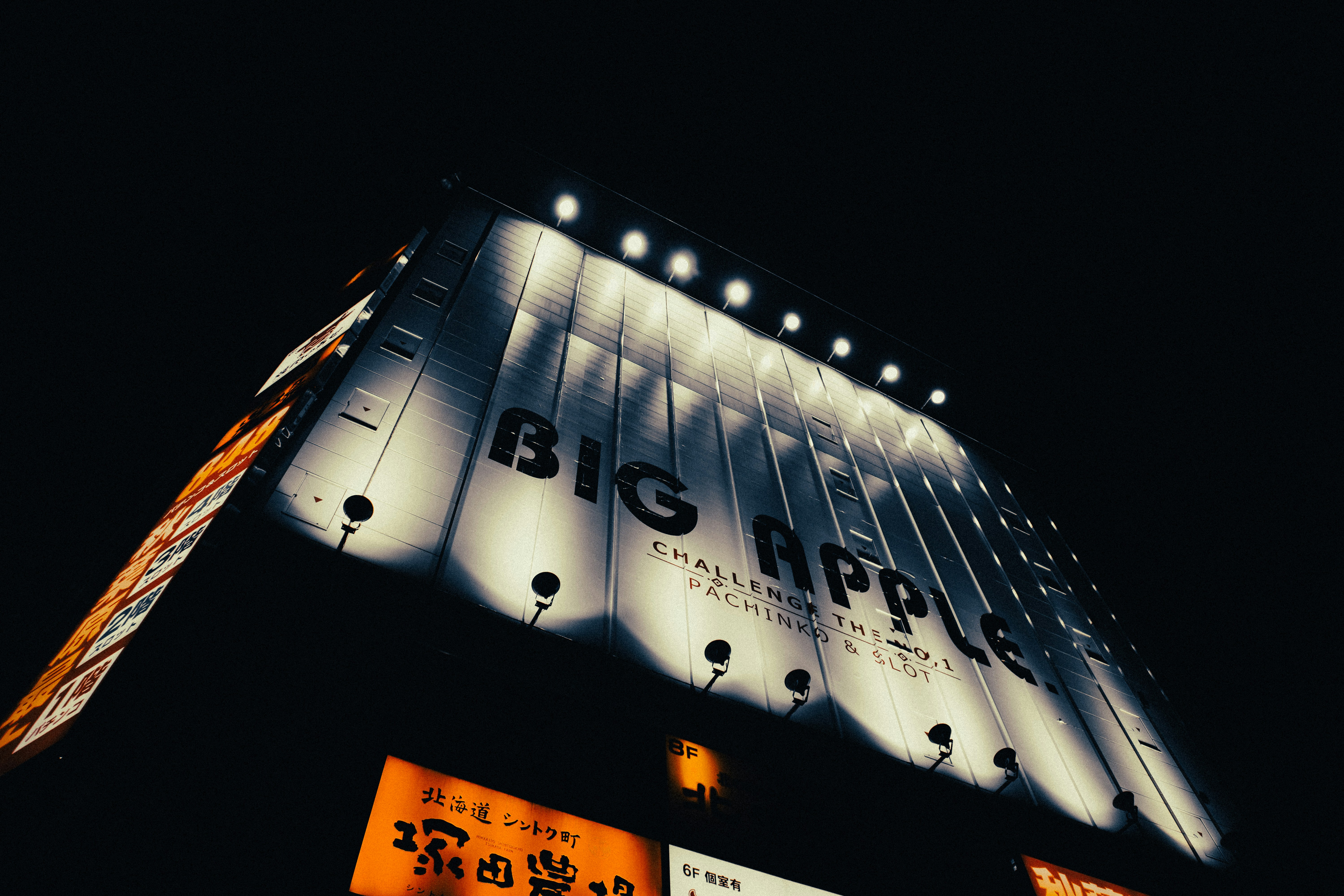 Big apple sign illuminated at night