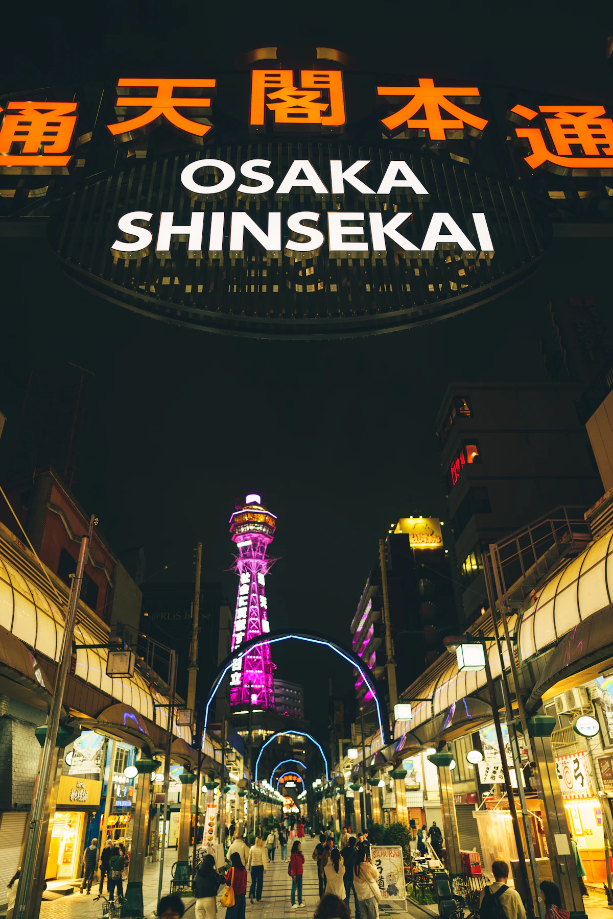 Shinsekai district at night with Tsutenkaku tower