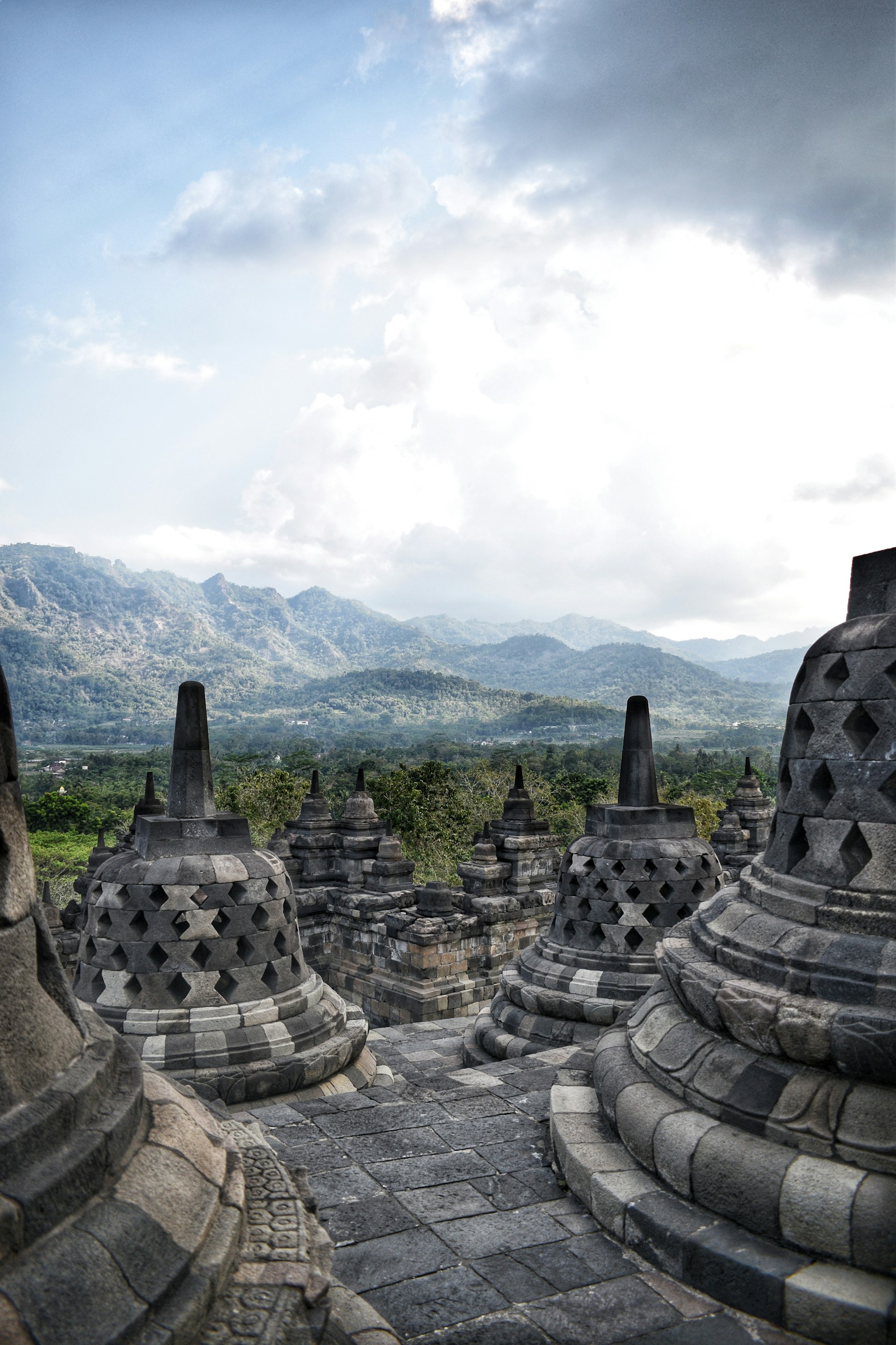 Ancient stupas with mountains in the background