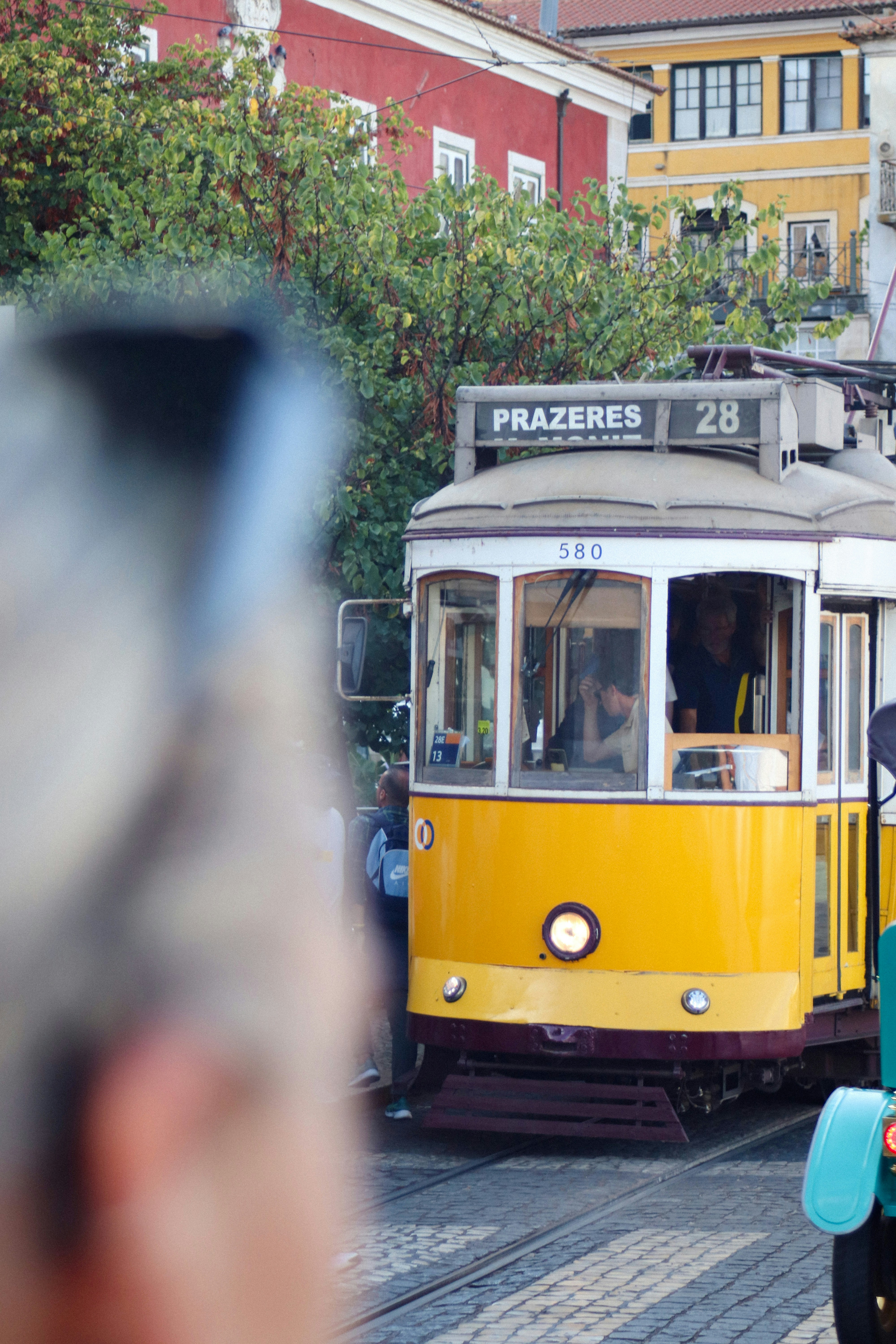 Yellow tram with destination sign prazeres 28