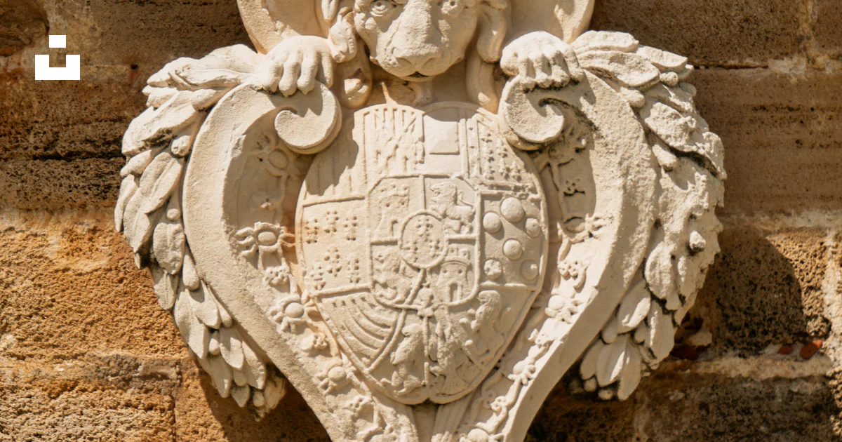 Stone crest with lion and crown on textured wall photo – Free ...