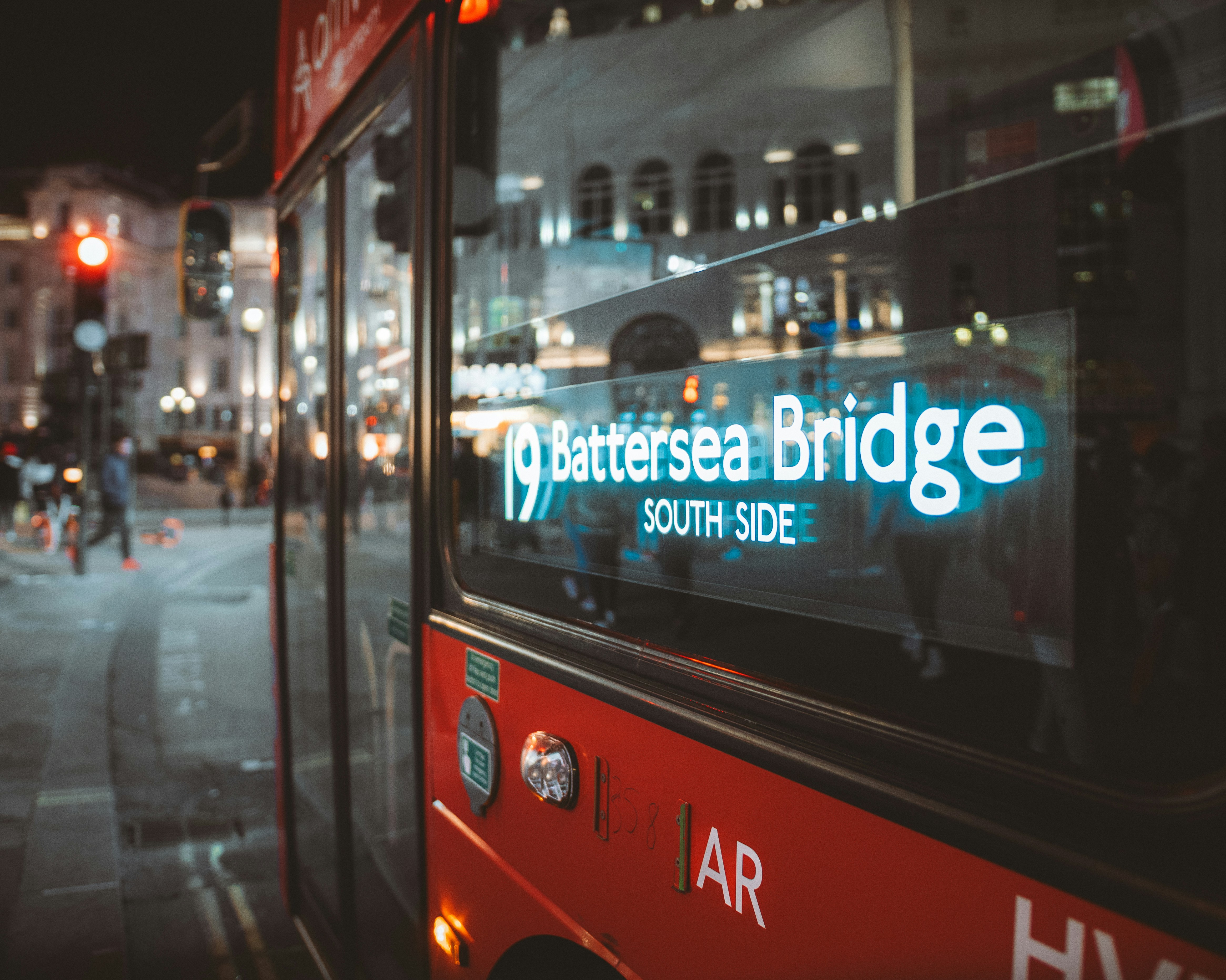 Red london bus with destination battersea bridge