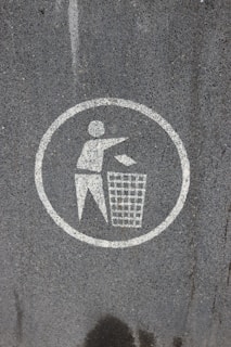 Do not litter sign on asphalt