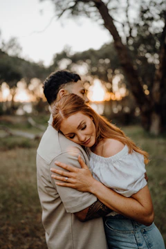 Couple embracing outdoors at sunset