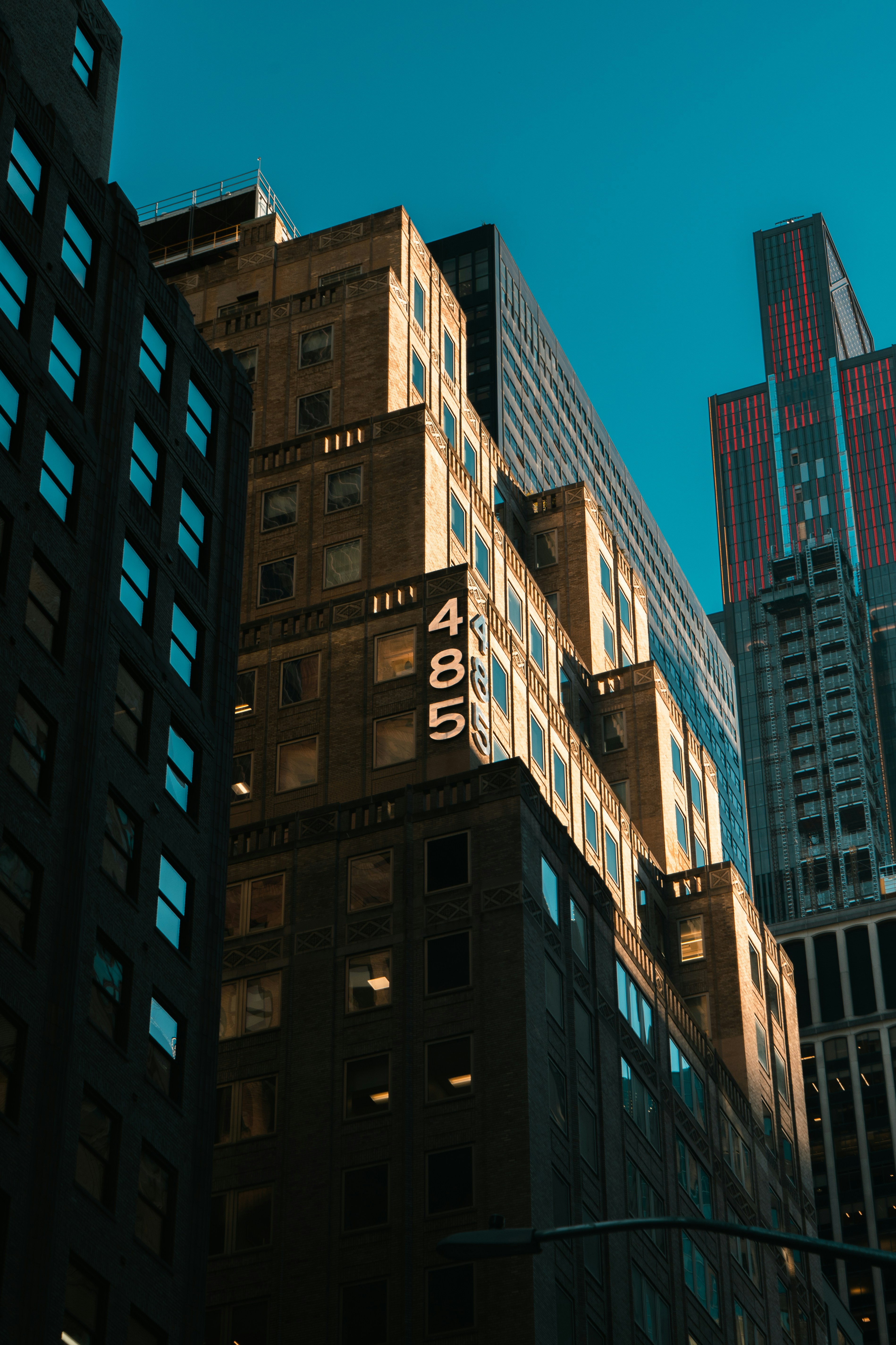 Modern skyscrapers against a clear blue sky.