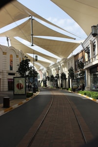 A modern street with shops and canopy structures