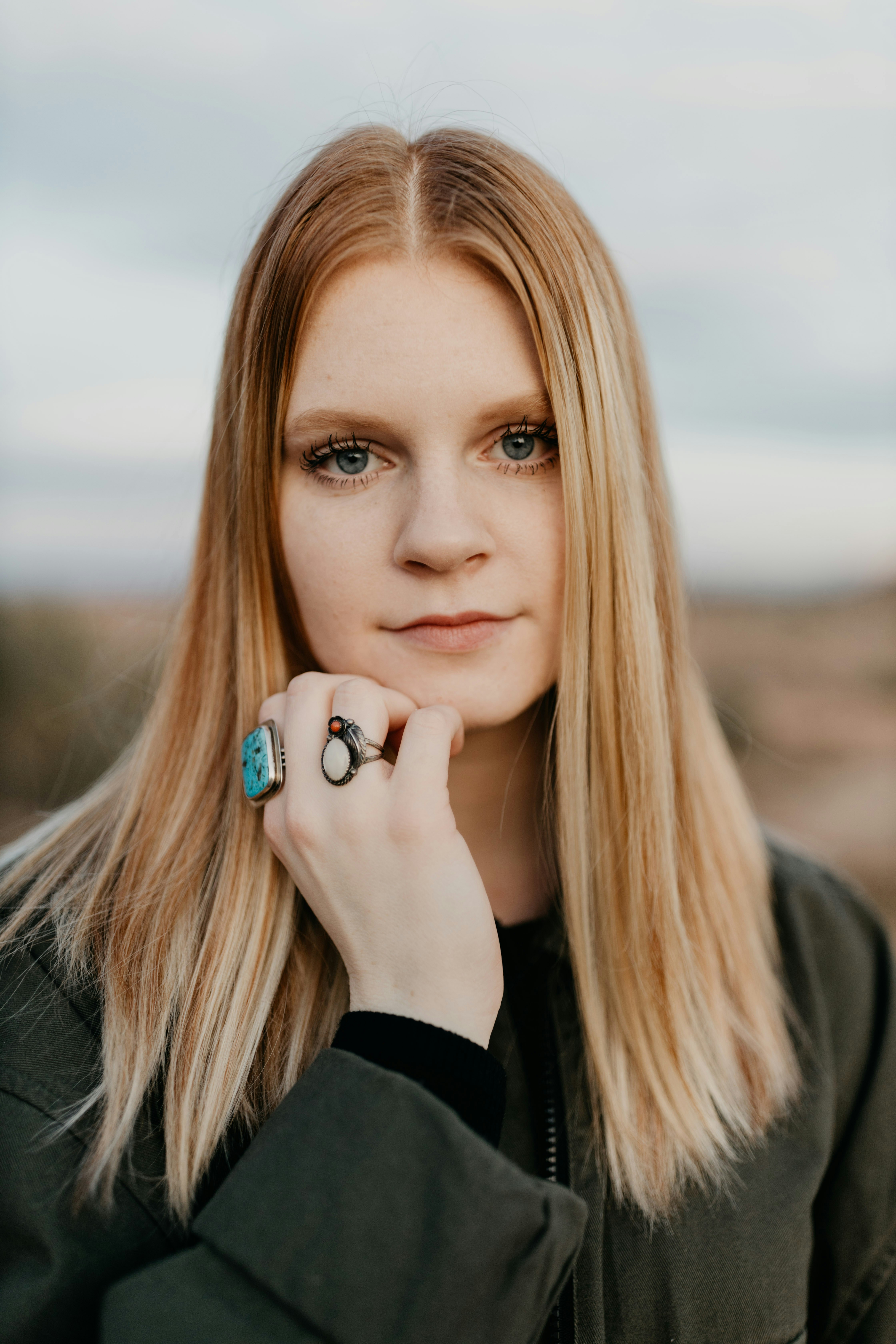 Young woman with blonde hair wearing rings